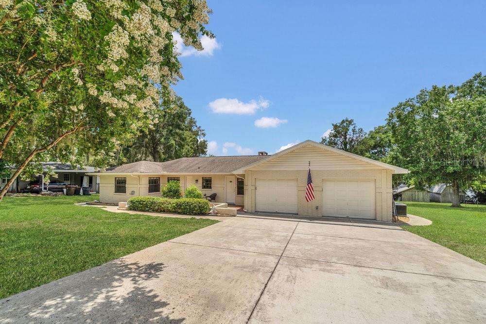 Welcome to your own slice of paradise on the shores of Lake Agnes! This beautifully updated 3-bedroom, 2-bath home with a bonus/flex room offers over 2,200 sqft of light-filled living space on nearly an acre of lakefront property—and no HOA restrictions! Step inside and be greeted by a spacious entryway adorned with charming shiplap-style walls. The home is filled with natural light, modern fixtures, and features luxury vinyl plank flooring throughout. The heart of the home is the gorgeous kitchen, complete with granite countertops, tile backsplash, stainless steel appliances, and an open layout that flows into the expansive dining area. Perfect for hosting with stunning lake views as your backdrop. Relax in the spacious living room featuring a cozy brick fireplace and sliding glass doors that open to a two-story screened porch overlooking the lake. Whether you're sipping your morning coffee or watching the sunset, this is your new favorite spot to unwind. The primary suite offers a peaceful retreat with a walk-in closet and a private en suite bath with granite-topped vanity and separate makeup area. Downstairs, the air-conditioned bonus room provides a versatile space for a home office, game room, guest suite, or hobby space—you choose! The backyard is a dream, complete with two storage sheds (one with power), a beachy shoreline, and three 30-amp RV hookups—perfect for visitors or your own rig. The two awnings on the lower level provide welcoming shade on hot Florida afternoons. You’ll also love the three motorized retractable screens, making it easy to enjoy bug-free evenings with a breeze—just at the touch of a button.
Enjoy fishing, boating, and lakefront living right from your backyard! Plus, you’re just minutes from I-4, 3 miles from Florida Polytech University, 20 miles to Legoland, and 25 miles to Disney. This is more than a home—it’s a lifestyle. Call today to schedule your private showing and discover all the charm this lakefront gem has to offer!