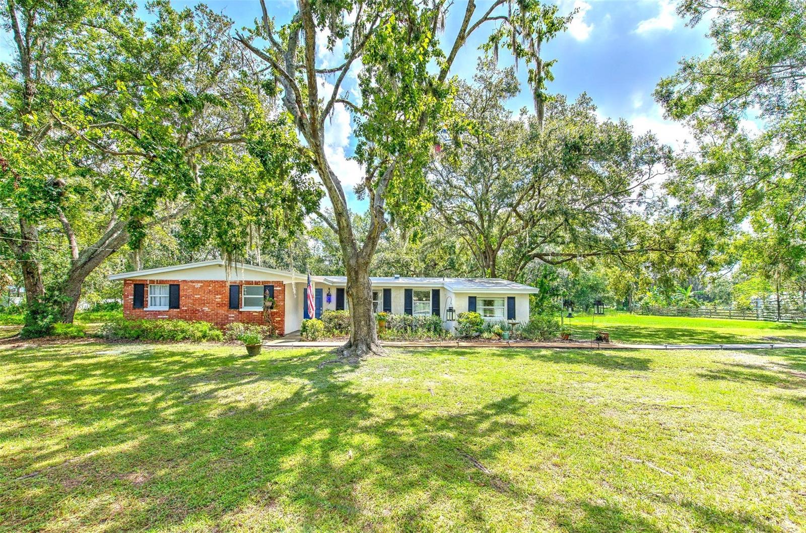 RARE LUTZ HOME - SITTING ON OVER AN ACRE - WITH PRIVACY, SERENITY, CHARM AND NO RESTRICTIONS!
Come fall in love with this unique, charming, immaculate 3-bedroom, 1-bath home with a versatile bonus room, perfectly situated on 1.06 acres of tranquility!
Tucked away on a quiet street with not much thru-traffic, you'll be surrounded by shady oak tree canopies, mature landscaping, and the peacefulness of country living while keeping you close to everything Lutz and Tampa has to offer.
Custom-built, meticulously maintained, loved and cared for by its original owners; it's now time to pass the torch and let someone new enjoy this home and property just as much as the current owners have. Listed for sale for the VERY FIRST TIME, a property as rare as this and located in one of Hillsborough County’s TOP A-RATED SCHOOL DISTRICTS, this home will not be on the market long.
As you step inside and you’ll be greeted by gorgeous polished terrazzo floors that flow throughout the home, adding timeless character and easy maintenance. The floorplan includes a spacious living area, natural sunlight in every room, three comfortable bedrooms, a fully updated bathroom, plus a flexible bonus room - ideal for a home office, additional living room, playroom, or guest space.
Out back, enjoy your mornings and evenings on the large covered, screened-in patio, where you can take in the peaceful views of your shaded backyard and feel like you're one with nature. A large metal shed provides plenty of storage for tools, hobbies, outdoor equipment or a workshop.
Best of all, this home comes with No HOA, No CDD, and is located in Flood Zone X (meaning flood insurance is not required) - giving you freedom and peace of mind. So, bring your Boat, RV, ATVs, or even start a Mini Farm...because the possibilities are endless!
This home also features a NEW ROOF (2022), Newer windows, Upgraded baseboards, New sheer curtains throughout, and furniture as an option.
Whether you’re been dreaming of a quiet retreat, a place to garden, or simply room to roam - this Lutz gem has it all. Contact the Listing Agent to schedule your private showing today, and see why this could be your next perfect home!