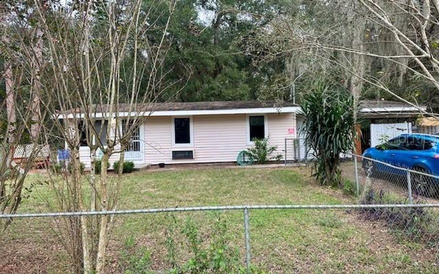 GREAT INVESTMENT OPPORTUNITY! This Single Family Home offers 2 Bedrooms, 1 Bathroom, a Kitchen with plenty of cabinet space, a Laundry Room/Utility Room, and a BONUS ROOM is located off the Dining Room. The CARPORT is quite big and can fit up to 4 cars. The spacious driveway can easily fit a few cars as well. This large backyard has a CONCRETE SHED that can be used for many different things. The FENCED IN YARD (Front/Back), allows for privacy, pets to roam free and family gatherings. Walking distance to Lake Smith! Don't miss out on this house that has so much potential and the possibilities are Endless! More photos to come soon!