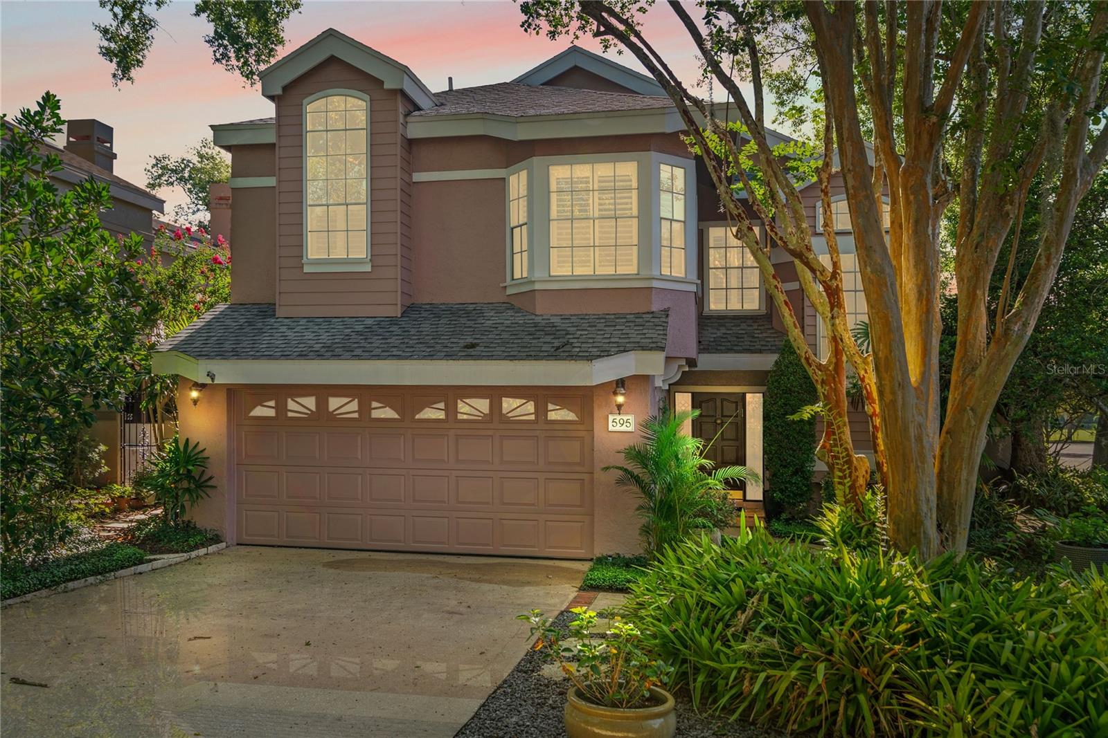 You Found It!!! Beautiful Winter Park townhome that feels like a single-family residence. Situated on a private lane with no through-traffic. Ten-minute walk to Park Avenue and Rollins, five-minute walk to Lake Virginia. This exquisite end-unit is part of a sought-after 10-unit community. Three Bedrooms and two and a half Baths, volume ceilings, pristine travertine marble floors and an abundance of natural light throughout. Enjoy green outlooks through every window. Eat-in kitchen with quartz countertops, separate coffee bar, and stainless-steel appliances. Formal dining room (or flex room) overlooking a patio/atrium. French doors expand the home onto two separate private and peaceful garden patios showcasing meticulous landscaping (with nighttime lighting), marble pavers and one with an updated screen enclosure. An upstairs master suite offers generous closet space with a skylit dressing area and bath with double sinks, soaking tub and walk-in shower. Jack & Jill Bath creates the perfect ensuite guest bedroom. Additional features include wood-burning fireplace, custom plantation shutters, and attached 2-car garage with ample built-in storage. Newer Roof (2021), HVAC (2024), Kitchen Cabinets renovated (2024), New Stove/Oven (2024), Exterior and Interior Paint (2025). Call and come see it! MAKE SURE TO CLICK ON THE 2 VIDEO TOURS