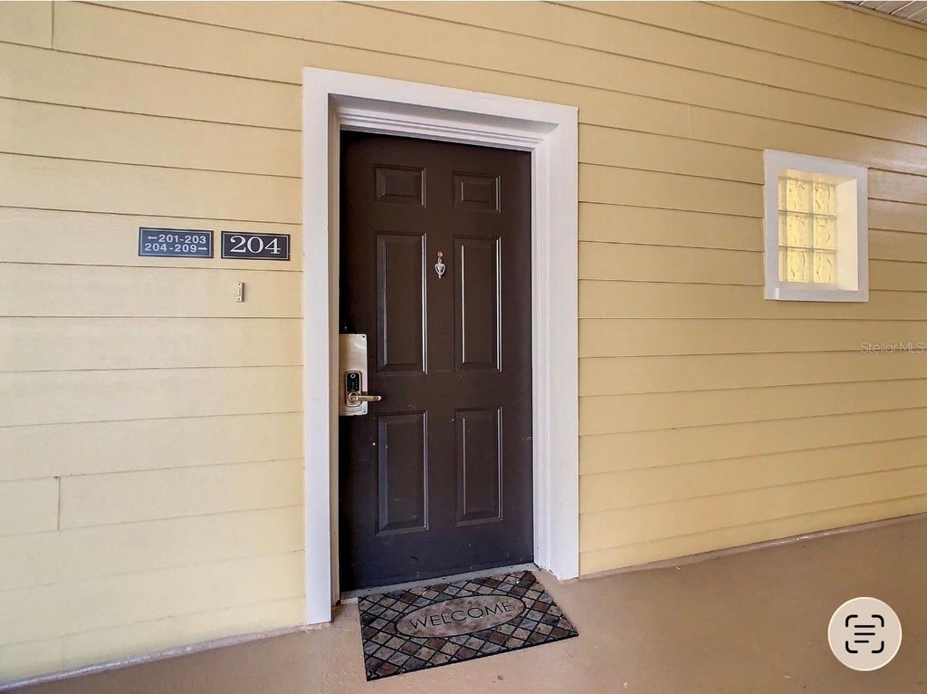 Photo of 9055 Treasure Trove Lane #204, Kissimmee, FL 34747 (MLS # O6446389)