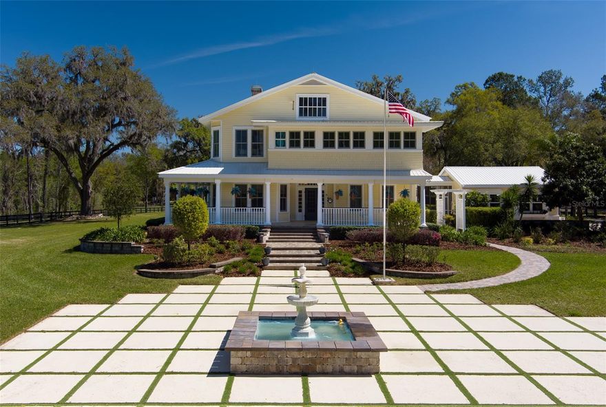 This stunning 23.06-acre farm, located just 20 minutes from the World Equestrian Center, offers an unparalleled blend of luxurious living and equestrian amenities. The property features 8 well-maintained paddocks, a round pen, and a spacious 80x200 covered arena, perfect for training and riding. The 8-stall center-aisle barn includes a 1-bedroom, 1-bathroom apartment, providing comfortable living quarters for staff or guests. The barn is well-equipped with a bathroom, feed room, tack room, and wash racks. Additionally, an outbuilding with four built-in kennels is ideal for dog lovers. The main house, a beautifully renovated home built in 1918, is a two-story traditional country residence with 5 bedrooms, 5 full bathrooms, and 1 half bathroom. Large windows, high ceilings, and expansive sunrooms bring in natural light, while multiple fireplaces, including one in the master en suite bath, create a cozy, welcoming atmosphere. Attached to the home is a 2-car garage, offering added convenience and storage space. Outside, you'll find a stunning pool with a spa, a spacious outdoor kitchen/grill area, a tennis court, and a koi pond, surrounded by breathtaking landscaping. This property offers a unique opportunity to enjoy both a luxurious lifestyle and world-class equestrian facilities, making it the perfect sanctuary for horse enthusiasts and nature lovers alike.