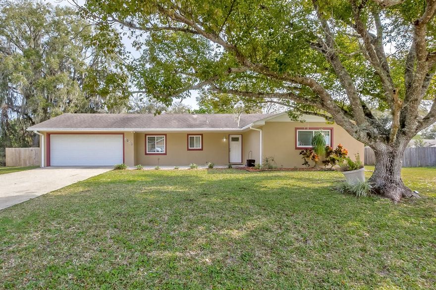 Ready to move in family home with a large fenced yard on a triple lot! Completely remodeled in 2005, this lovely home with an open floor plan has many recent upgrades, such as newer double pane impact windows, recently remodeled 2nd bath and beautiful new luxury laminate flooring throughout. Modern and open kitchen with lots of natural light, stone counter tops, stainless steel appliances, spacious breakfast bar and plenty of cabinets. Open living area with door leading to the tiled glass enclosed Florida Room which overlooks the large back yard. Spacious Master Suite with tiled shower and laminate flooring; two additional bedrooms with built-ins share the 2nd large bath. Oversized garage with step up laundry room with sink and additional storage area. Very spacious back yard with fence and solid shed, irrigation system on well. Seller will pay for one year home warranty for buyers. A great home for the family! All measurements approximate ;Water: City