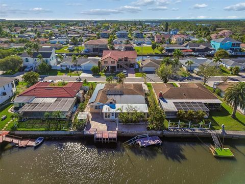 Photo of 9900 Island Harbor Drive, Port Richey, FL 34668 (MLS # TB8487509)