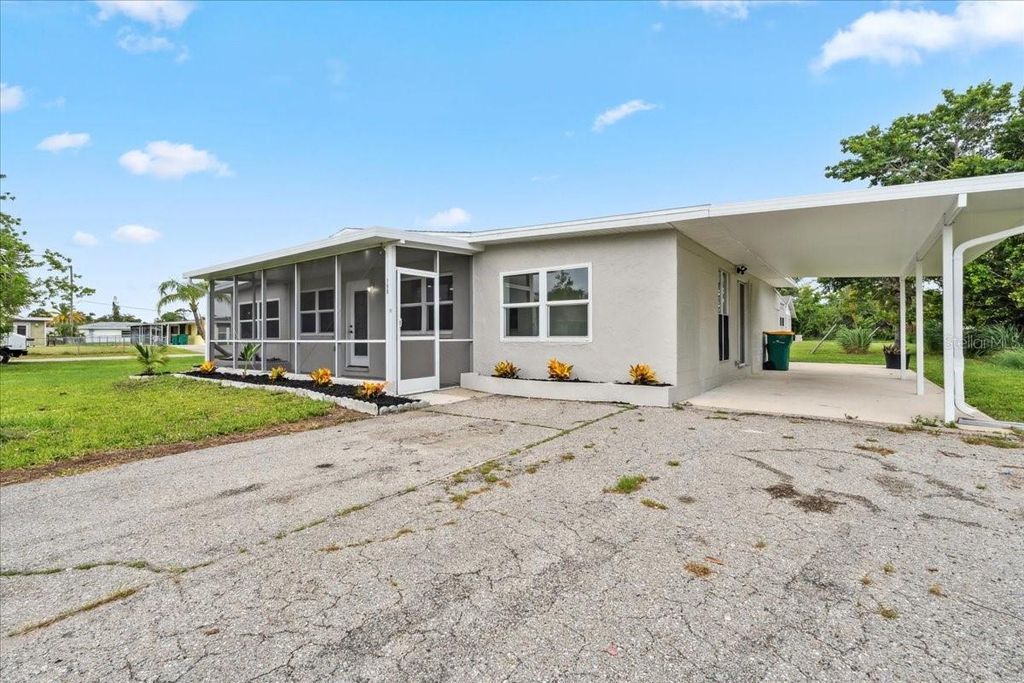 Photo of 198 Cypress Avenue NW, Port Charlotte, FL 33952 (MLS # TB8408039)