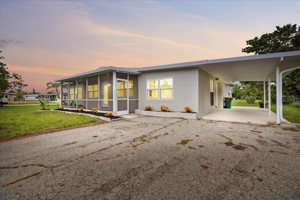 Photo of 198 Cypress Avenue NW, Port Charlotte, FL 33952 (MLS # TB8408039)