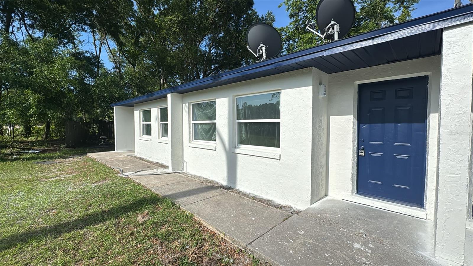 Welcome to this beautifully updated unit featuring modern touches and a clean, stylish design. This 2-bedroom, 1-bath home offers brand new flooring, fresh interior and exterior paint, and updated fixtures throughout. Enjoy the ample natural light, and a spacious yard surrounded by mature trees—perfect for relaxing or entertaining. Located in a peaceful area just minutes from UF, Santa Fe College & I-75. Move-in ready.