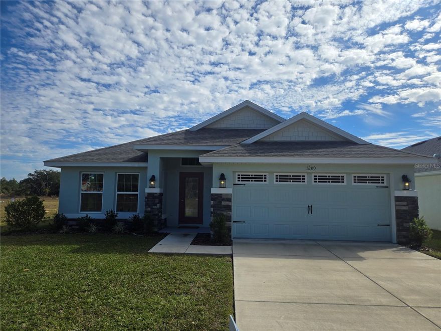 The Floridian - HUGE YEARLY BLOW OUT SALE, 40K PRICE IMPROVEMENT! Located in the " Premier Gated, Lakeside Community of Wyld Palms - The 2020 floorplan is a contemporary and well - designed layout that caters to the needs of modern families. Featuring a spacious living area with an open - concept design, creating a seamless flow between the main living spaces. The kitchen is thoughtfully designed with modern appliances, ample counter space, and a breakfast area. The bedrooms are strategically placed to provide privacy and comfort. The master suite features a generous bedroom, a walk - in closet, and an ensuite bathroom with double vanity and a glass enclosed walk-in shower. The three additional bedrooms have adequate space for family members, and guests or a designated space for a home office. The 2020 floor plan also includes a large laundry room, a concrete patio for outdoor living, and a 2 - car garage. The thoughtful design and practical layout provide for a comfortable, functional home. The community offers a state-of-the-art club house, swimming facilities and gym. THIS COMMUNITY OFFERS LOW HOA FEES, ASSISTANCE WITH CLOSING COST WHEN THE BUYER CLOSES WITH THE SELLERS APPROVED LENDERS. ASK ABOUT THE ADDITIONAL BUYER INCENTIVES! Just minutes from downtown Inverness, near the rails to trails, boating, parks, restaurants, entertainment, shopping and much more! 1 hour to Tampa & Orlando. NOTE: THE REDUCED PRICE IS A PROMOTION, PRICE EFFECTIVE UNTIL 5PM ON 02/01/2026 Prices are subject to change. Located on lot: 144