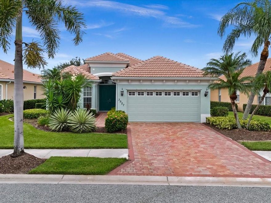 One or more photo(s) has been virtually staged. 1 YEAR HOME WARRANTY INCLUDED! SELLER MOTIVATED! Discover serene lakefront living in the prestigious Heron Creek Golf & Country Club in North Port, Florida! This lovingly maintained 3-bedroom, 2-bath single-family home offers peaceful water views, a HEATED POOL AND SPA with full screened enclosure (Resurfaced pool, repainted and rescreened enclosure, and new pool pump 2023) and lush tropical landscaping for added privacy and beauty. Step inside the 8' Double Entryway doors to find a bright and cheerful open concept layout with formal dining room and large Great Room with tray ceiling and 8' Tall Sliders to Lanai! The spacious Kitchen features newer stainless steel kitchen appliances, double undermount sink, deluxe raised panel cabinetry, granite countertops, and dinette area with Aquarium windows make it perfect for everyday comfort and entertaining. The built-in mirrored hutch and dry bar create a lovely backdrop whether you enjoy the formal dining experience or need flexible space for your Grand Piano! The Primary En-Suite is tucked away and features a tray ceiling, deluxe woodworking and trim, ceiling fan, oversized baseboard, large walk in closet with built ins and partition, a large bathroom with dual sinks, vanity area, tiled shower and water closet. In addition, you have two bedrooms, one sunny yellow with a fold-down desk from the closet, and the other shown as a home office with Executive Desk and credenza included!  Other features include tile flooring throughout the main living areas, two in-floor outlets, luxury vinyl plank in the primary bedroom, painted inside and out n a neutral coastal color palette, extra deep (31 feet) garage leading to Laundry Room with cabinets and laundry tub, architectural appointments inside and out, and a BRAND NEW TILE ROOF in 2024! Live the luxury lifestyle that comes with residing in this Arthur Hills designed Golf Course community, where more than 430 acres have been curated perfectly to balance environmentally protected nature preserves, expansive lakes and green space with the 27-hole Championship Golf Course. You'll be sure to enjoy the activities and events hosted at the elegant clubhouse, and have access to the fitness center, tennis courts, community pool, and more! NO CDD Fee, and LOW Quarterly dues cover lawn care, tree and shrub maintenance, irrigation water/system, INTERNET and Cable TV.  Live, work, and play at Heron Creek—where every day feels like a getaway!