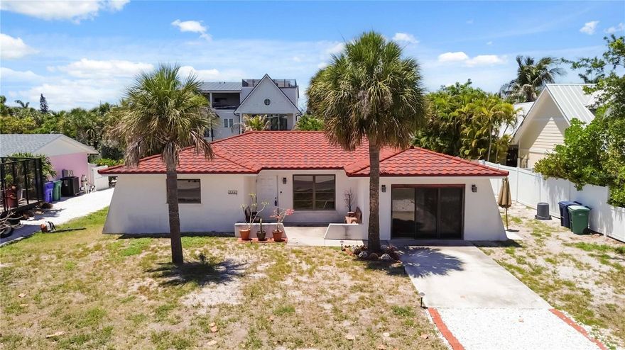 LOCATION! NEW STEEL ROOF! .19 ACRE LOT! RARE ARTISAN WELL! MOTHER-IN-LAW SUITE! 
Opportunity is knocking on one of the most desirable streets on Anna Maria! This rare opportunity offers incredible potential in an unbeatable location. Just moments from the beach, the bay, the community center, and the shops and restaurants of Pine Avenue. This 3 bedroom, 3 bathroom home sits on an oversized .19-ACRE LOT in the heart of Anna Maria. 

The property features a NEW STEEL ROOF installed in MAY 2024 with a TRANSFERABLE 50-YEAR WARRANTY, providing a major upgrade already completed for the next owner. One of the bedrooms functions as a private mother-in-law suite with its own separate entrance, full bathroom, and existing hookups for a kitchenette - ideal for guests, extended family, or added rental flexibility. 

A unique highlight of the property is the separately deeded ARTISAN WELL, which supplies irrigation water to the community center as well as neighboring properties. This creates both community value and potential tax benefits! 

WEEKLY RENTALS are allowed, making this an outstanding opportunity for investors, builders, or buyers looking to create their dream island home. The property experienced flooding and will require renovation/gutting, but the location, lot size, and valuable existing features make this a truly exceptional investment opportunity on Anna Maria Island!