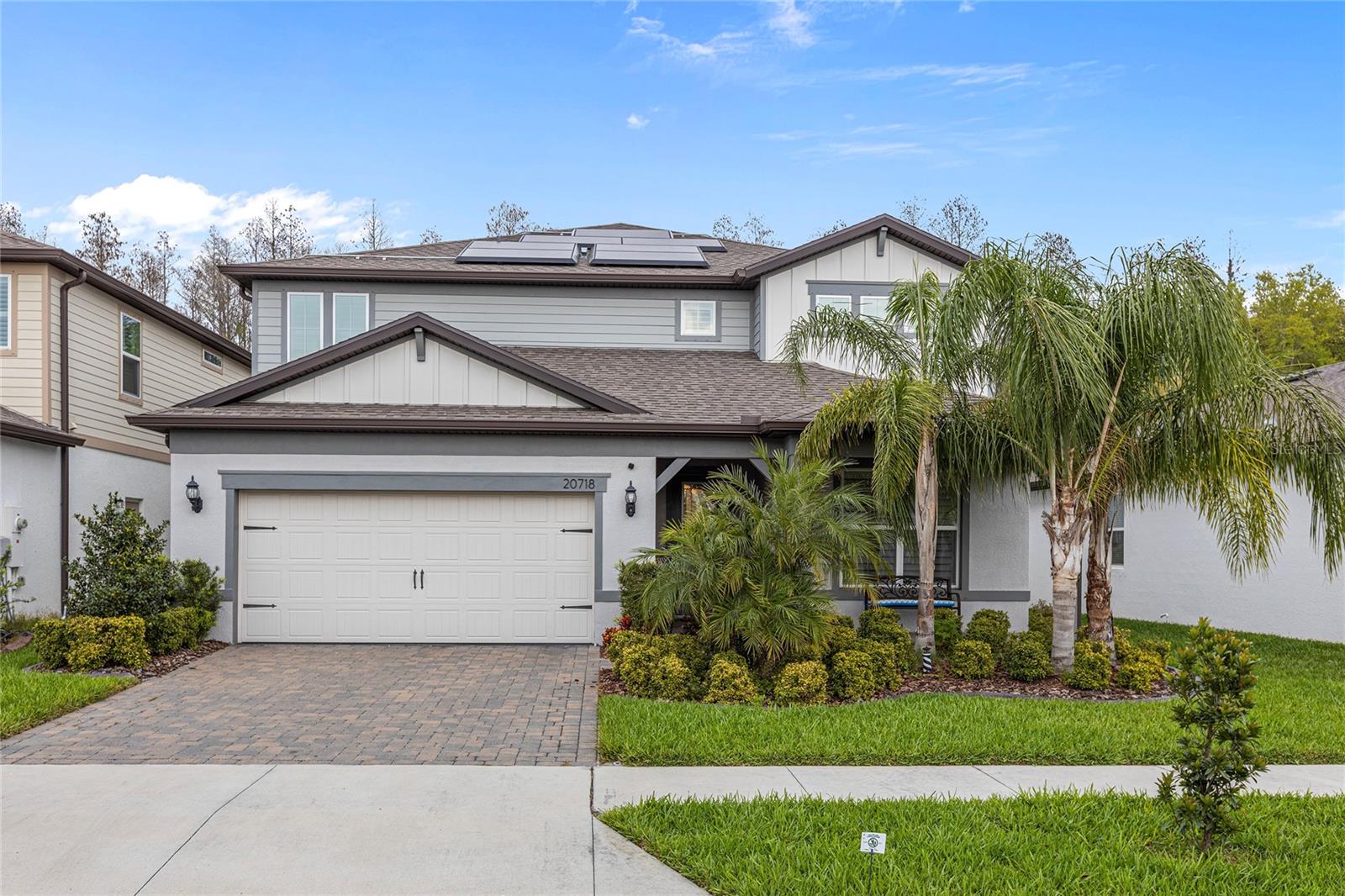 This home blends energy efficiency, smart tech, and everyday comfort in all the right ways. It’s powered by a full Tesla Solar setup—27 panels (11.48 kW) and a Powerwall that gives you up to 3 days of backup power. You’ve got central electric heating, Energy Star-rated windows, plantation shutters, and smart home features that make life a little easier and a lot more efficient. Inside, this stunning 5-bedroom, 4.5-bath estate sits on a peaceful conservation lot in a private, gated community. With nearly 3,500 square feet of beautifully upgraded space, it checks all the boxes—style, function, and flexibility. The kitchen is a total showstopper, with sleek quartz counters, high-end stainless steel appliances, and elegant finishes throughout. Step outside to your own private retreat with a saltwater pool and spa, tropical landscaping, and no rear neighbors—just total privacy and relaxing views. The layout works for everyone: the primary suite is upstairs, and there’s a second en suite downstairs—perfect for guests, in-laws, or multigenerational living. You’ve also got a spacious loft wired for surround sound, a tandem 3-car garage, a pre-wired alarm system, and thoughtful updates throughout. Located close to everything—major roads, top-rated schools, shopping, dog parks—this one delivers high-end living with low-maintenance peace of mind