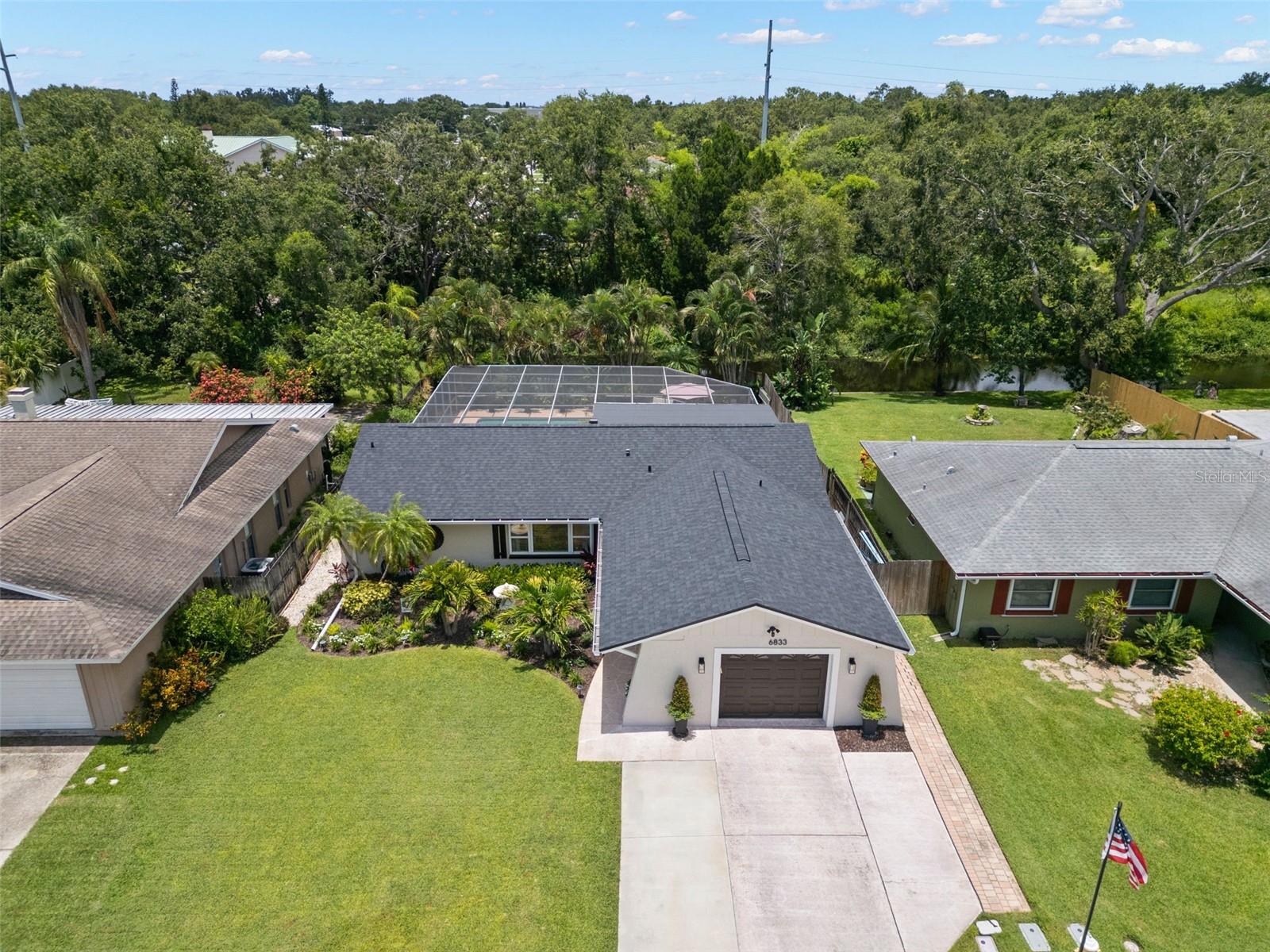Canal wildlife waterfront POOL HOME on Oversized Lot in Bonnie Glynn –MOVE-IN READY with Extensive Upgrades! Welcome to 6833 Circlecreek Drive in the desirable Bonnie Glynn community—a rare opportunity to own a beautifully maintained, move-in ready pool home on an oversized lot (60X160) backing to a tranquil FRESHWATER CANAL with a lush bird sanctuary view. NO DAMAGE DURING RECENT HURRICANE AND NO INTERIOR FLOODING. Enjoy direct canal access perfect for kayaking, paddleboarding, or watching the turtles swim up to greet you. This fenced outdoor oasis is ideal for relaxing or entertaining, with a screened lanai enclosing a CONCRETE POOL and a spacious 13x11 FLORIDA ROOM that seamlessly connects indoor and outdoor living. The well-landscaped yard and inviting exterior set the tone for Florida living at its best. Step inside to a light-filled den that leads to the recently updated kitchen, complete with STAINLESS STEEL APPLIANCES (including a NEWER DISWASHER in 2023), new SHIPLAP CEILING (2025), a breakfast bar, abundant cabinets, new cabinet pulls (2025), a pantry closet, and stylish new lighting. The combined dining and living room is perfect for hosting family and friends for gatherings or holiday celebrations.
This thoughtfully designed split floor plan offers privacy and comfort with two spacious bedrooms. The owner’s suite features a large WALK-IN CLOSET and an ensuite bath with walk-in shower. The second bedroom and bathroom are equally well-appointed with new faucets (2024) and new vanity lighting (2025). Extensive upgrades include: NEW ROOF AND GUTTERS (7/25) New exterior paint (4/24) and updated landscaping (3/24) New interior paint (1/24) with modern knockdown ceiling texture (3/25) All new ceiling fans (11/24) New front entry door (3/24) with push-button entry handle and matching hardware (4/25) New metal insulated garage door and frame (4/25), new attic stairs (5/25)
NEW STACKABLE WASHER AND DRYER (11/23) The oversized garage includes a laundry area and extra storage, while the quiet, friendly neighborhood offers convenient access to schools, shopping, dining, and the beautiful Gulf beaches.Bonus: The furniture is negotiable for sale outside of the contract—making it even easier to move right in and start enjoying your new Florida lifestyle! Don’t miss your chance to own this one-of-a-kind waterfront retreat. Call today to schedule your private showing!
