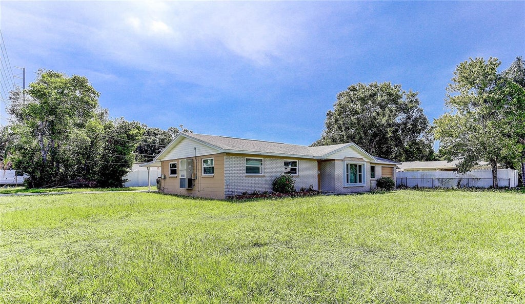 Photo of 7703 Lakeside Boulevard, Tampa, FL 33614 (MLS # TB8543949)