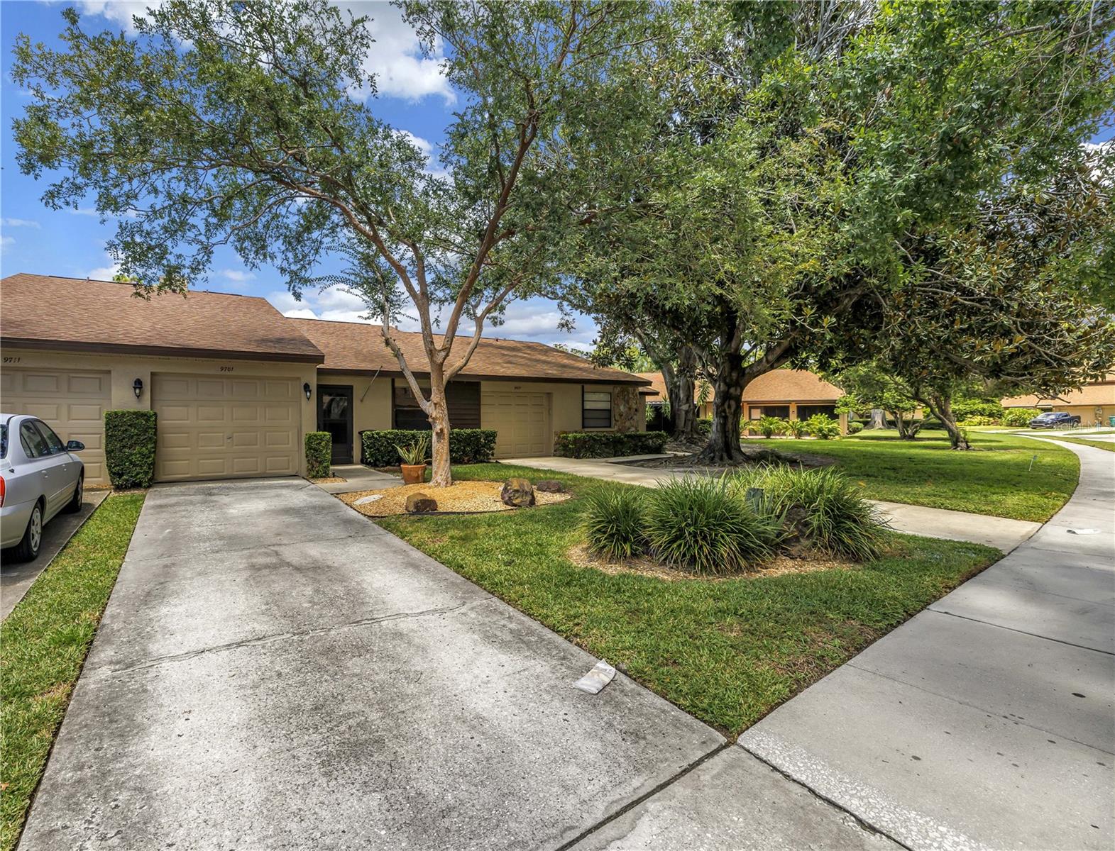 Beautifully redone 3 bedroom, 2 bath villa in Lake Seminole Village! Every detail has been carefully considered. Every upgrade has been tastefully chosen. Gorgeous open floor plan and vaulted ceilings with skylights accented by recessed lighting highlight how spacious and bright this villa is. Beautiful luxury vinyl flooring runs throughout the villa. The home cook is sure to appreciate the spacious kitchen with soft-close cabinetry and quartz countertops. Enjoy ample cabinet space as well as a breakfast bar. You can even look out at your backyard oasis from your kitchen window. Plenty of space to entertain with both the expansive living room AND a family room overlooking the backyard. Split floor plan allows for privacy for everyone. The primary bedroom is spacious and can accommodate large furniture. It also has a completely renovated en-suite bathroom complete with a generous walk-in closet, quartz vanity and an upgraded tiled walk-in shower. Additional bedrooms are also generously sized. The guest bathroom is updated with a tub shower combo with a modern soaking tub and quartz vanity. The inside utility room makes laundry a breeze. Relax with your morning coffee from the comfort of your back private patio, or is also a great spot to enjoy a backyard BBQ. The location of this villa is superb – backs up to a quiet greenspace. The golf-cart garage includes plenty of storage space. This home has been lovingly cared for and includes a newer roof (2017) and AC (2017). Located on a peaceful street and just a short walk from the newly re-done pool this is a prime location in the neighborhood! Located in a no flood zone! Saves you money and offers peace of mind. Pride of ownership is evident in this community. Lake Seminole Village is a perfectly maintained, deed restricted neighborhood. The association maintains your lawn, exterior painting, irrigation systems, resort style pool, roofs and includes Internet AND cable package. This is an easy living lifestyle conveniently located just minutes from Lake Seminole Park, Seminole City Center & several of Florida’s World Class Beaches. A QUICK CLOSING IS OK HERE!