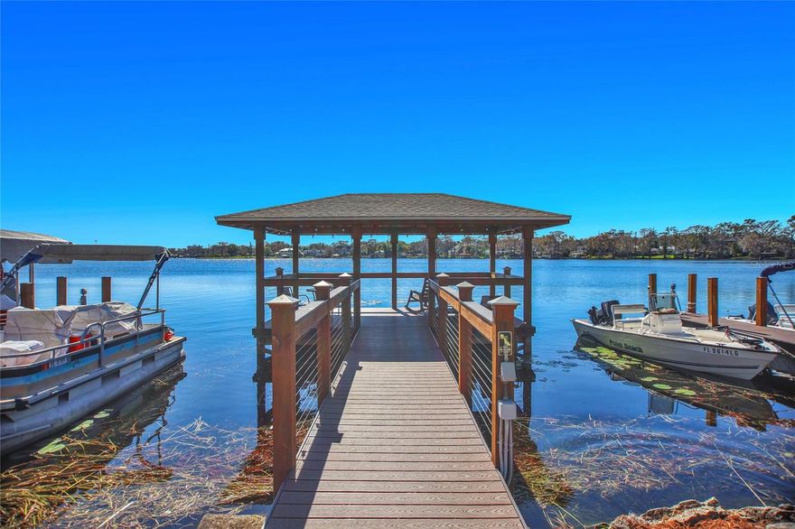 Welcome to your next chapter of lakeside living! This charming one-bedroom, one-bathroom condo offers a perfect blend of tranquility and convenience in the heart of Winter Park. Step inside to discover a thoughtfully designed space where comfort meets style. The open-concept living area welcomes you with beautiful engineered wood floors, creating a seamless flow between the living room and kitchen. Natural light streams through the windows, highlighting the warm and inviting atmosphere throughout.Your private bedroom retreat features a generously sized closet, making storage a breeze. The well-appointed bathroom complements the living space perfectly. What truly sets this home apart is its privileged location near Lake Killarney, a stunning 239-acre spring-fed lake that serves as your backyard oasis. As a resident, you'll enjoy exclusive access to on-site boat slips, a launch, and an updated dock. Take a peaceful stroll along the 60-foot walkway leading to a covered gazebo - the perfect spot for your morning coffee or evening sunset views. The community amenities include a lakefront pool and clubhouse, while the meticulously maintained grounds showcase lush Florida landscaping. Located just moments from Winter Park Village, you'll find fantastic shopping, dining, and entertainment options right around the corner. Experience the joy of maintenance-free living while being connected to nature and urban conveniences. This hidden gem won't last long!