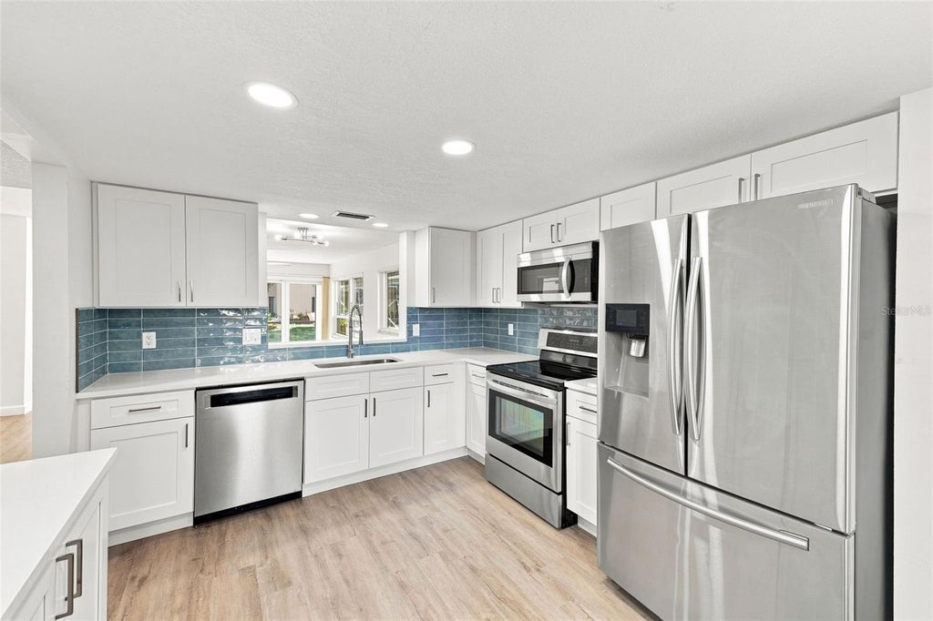 Photo of 700 Starkey Road #311, Largo, FL 33771 (MLS # TB8545451)