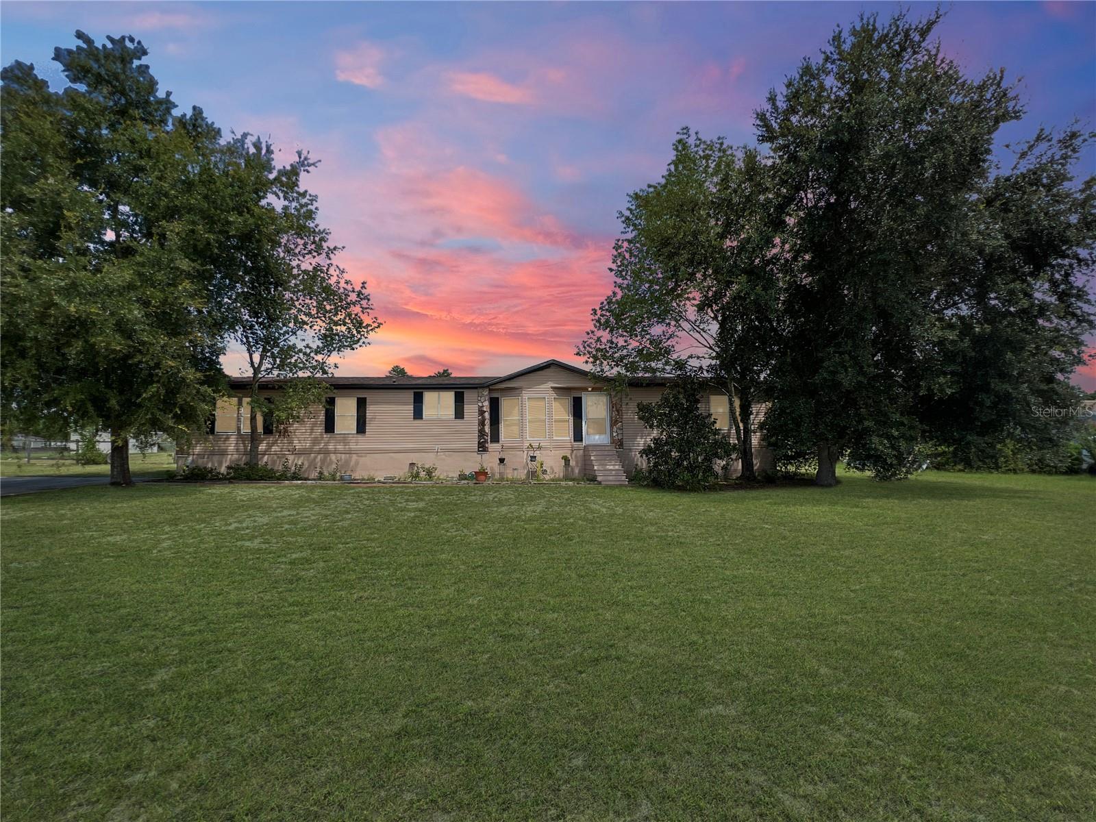 Welcome to your serene retreat in Ocala, Florida! This charming 3-bedroom, 2-bathroom manufactured home sits on nearly 1 acre of land, offering modern comforts and privacy.
Relax in the garden bath, perfect for unwinding. Primary also has walk-in shower.
Warm up by the wood-burning fireplace in the spacious living area or electric fireplace in the primary bedroom.
Fully fenced backyard complete with two sheds for ample storage and a fire pit. There is gas hooked up for the stove.
Nearly an acre for gardening, hobbies, or future dreams.
Enjoy the best of Florida’s horse country with easy access to local amenities.
Ready for its new owners and packed with charm. Don’t miss out—schedule your tour today!