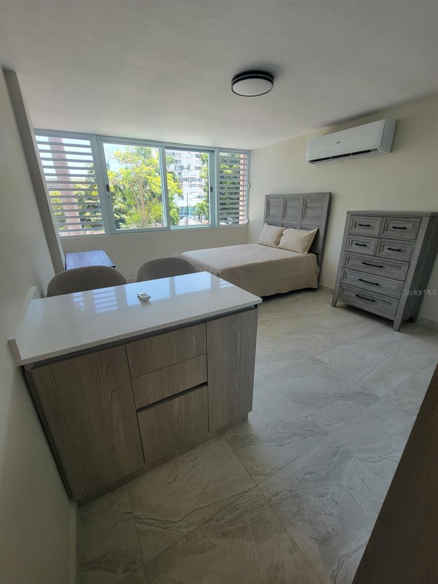 Enjoy the best of beachside living in this fully furnished turnkey studio located on the 3rd floor of the desirable Marine View Condominium in Isla Verde. With 318.08 sq ft of well-designed space, this bright and modern unit is ideal as a personal retreat, long-term rental, or starter home in one of Puerto Rico’s most vibrant neighborhoods.
The open-concept layout features a functional kitchenette, updated bathroom, and large windows that fill the space with natural light and coastal breezes. The sale includes a deeded parking space—a valuable asset in this high-demand area.
While there is no direct beach access, Isla Verde Beach is just a short walk away. The location offers excellent convenience with restaurants, supermarkets, and the airport all within close proximity.
Short-term rentals are not permitted, ensuring a quiet and residential atmosphere.
Financial Details:?• HOA: $65/month?• Hazard Insurance: $560.55 (Apt. 303) / $336.45 (Parking 107) annually?• CRIM (Property Tax):? • Apt: $1,121.10/year (041-078-007-11-007)? • Parking: $57.18/year (041-078-007-11-026)