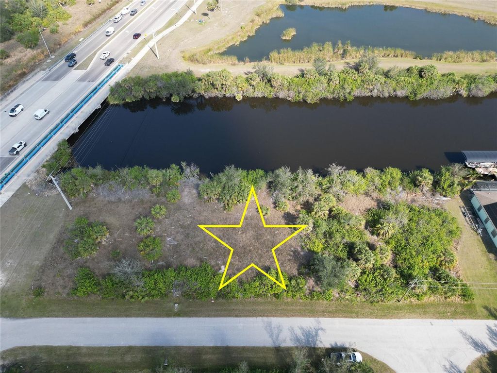 Photo of 13914 Orbit Avenue, Port Charlotte, FL 33981 (MLS # D6140568)