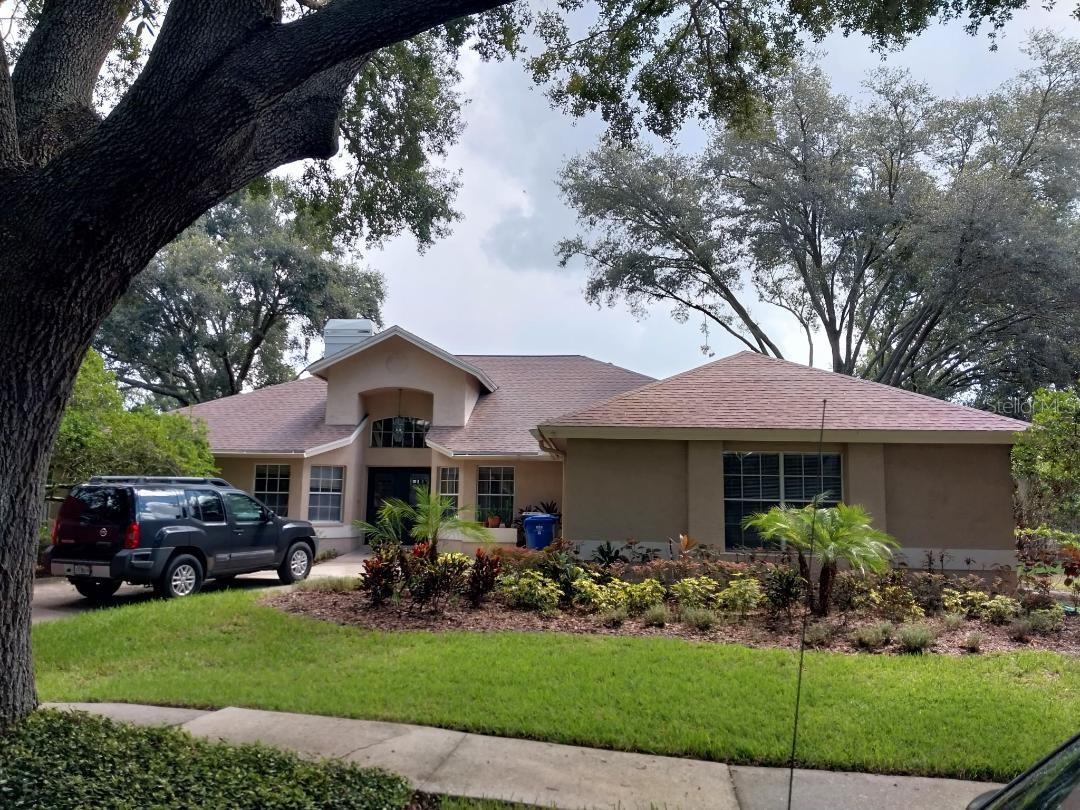 This lovely 4 bedrooms 2 bath Pool Home offers a warm and inviting natural atmosphere with lots of space to relax and grow. The home boast high ceilings with a bright and airy feel. Additionally, the home has a new shingle roof installed on 8/10/2025, along with a completely remodeled master bathroom. The Kitchen refrigerator, microwave, and dishwasher are all less than 2 years old, new washing machine April 2024, new fence January 2024, and new chimney cap May 2024. The pool area has a screened lanai and is surrounded by great landscape and a wonderful place to sit outside and enjoy the wonderful scenery. Home is as-is with the right to inspect.