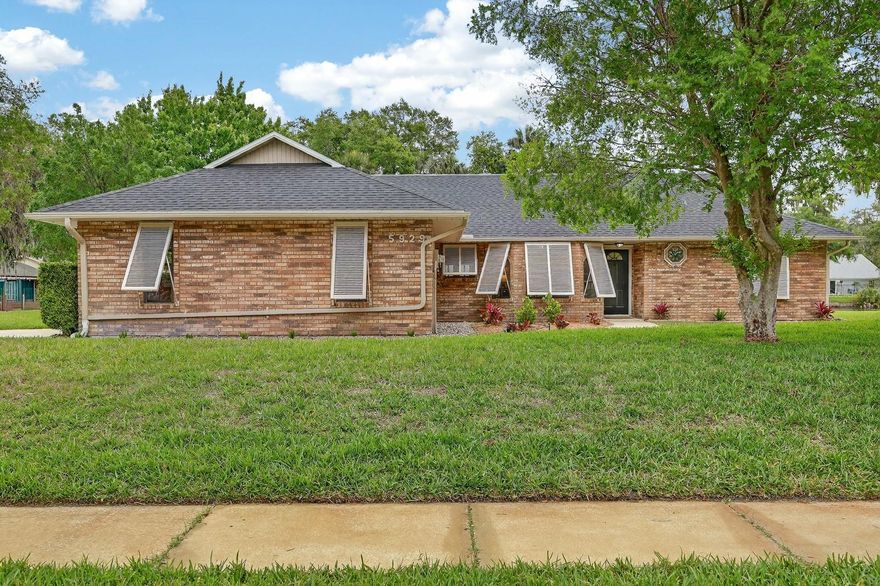 Welcome to 5929 Hatteras Dr, a beautifully updated corner-lot home offering the perfect blend of comfort, style, and waterfront charm. Ideally situated in a highly sought-after area of Volusia County, this property features serene lake views and is located within an A-rated school district, making it an exceptional opportunity for families and buyers alike.

Step inside to a spacious open layout with vaulted ceilings, abundant natural light, and a seamless flow between living, dining, and kitchen spaces. The heart of the home is the fully refreshed kitchen, showcasing updated cabinetry by Lilly Cabinets, new tile work (2025), and a brand-new breakfast bar countertop (2025), perfect for both everyday living and entertaining. New luxury vinyl plank flooring (2025) runs throughout, giving the home a modern, cohesive feel.

Both bathrooms have been tastefully updated with new tile (2025), and the home is further enhanced by custom California Closets installed in the primary and guest bedrooms (2023), providing exceptional storage and organization.

Step outside to enjoy the oversized screened-in patio, an ideal space for relaxing or hosting, overlooking a fully fenced backyard with peaceful water views. The corner lot provides added privacy and curb appeal, while the location offers unbeatable convenience, just minutes from local favorites like Neighbors Ice Cream and close to shopping, dining, and everyday essentials.

Additional highlights include a cozy fireplace, spacious bedrooms, and a functional layout designed for both comfort and convenience.

This move-in ready home combines thoughtful upgrades, prime location, and lifestyle appeal , don’t miss your opportunity to own a standout property in one of Volusia County’s most desirable areas.