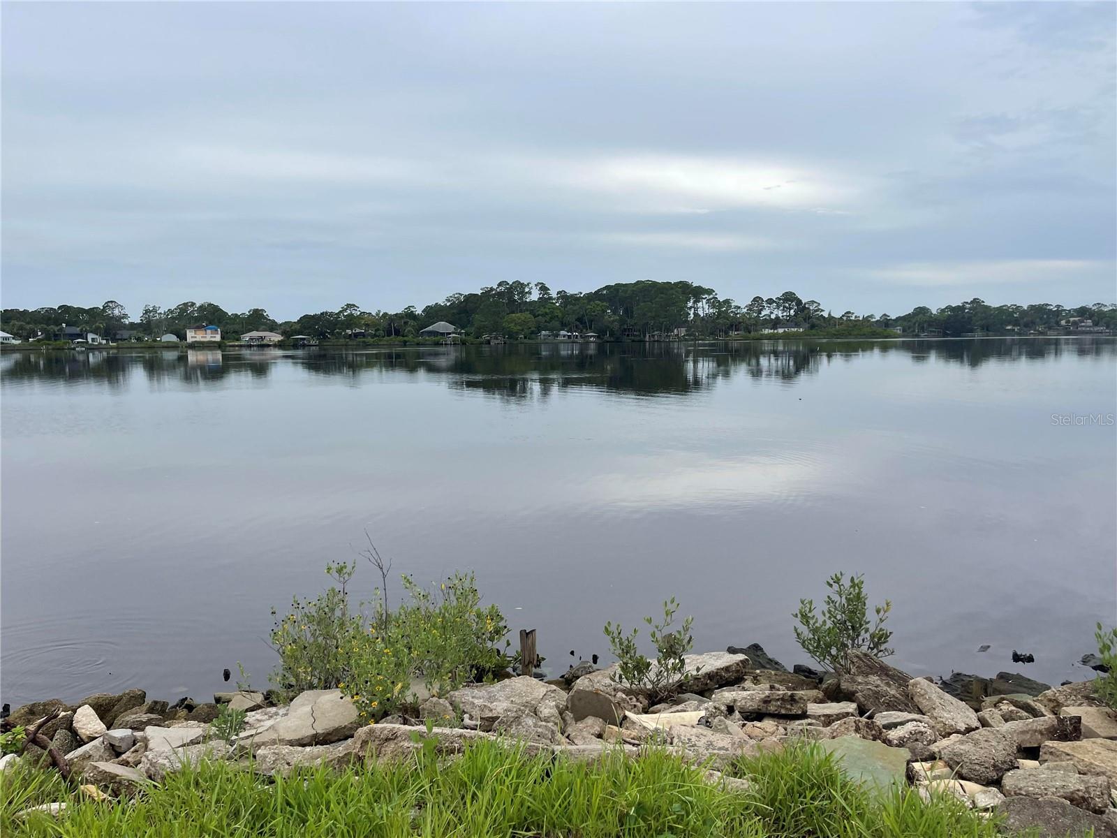 Rare 1 acre waterfront lot on tranquil Turnbull Bay. This expansive lot is surrounded by water on three sides. Lot is cleared and ready to build your dream waterfront home. Owner is a licensed Real Estate Broker.