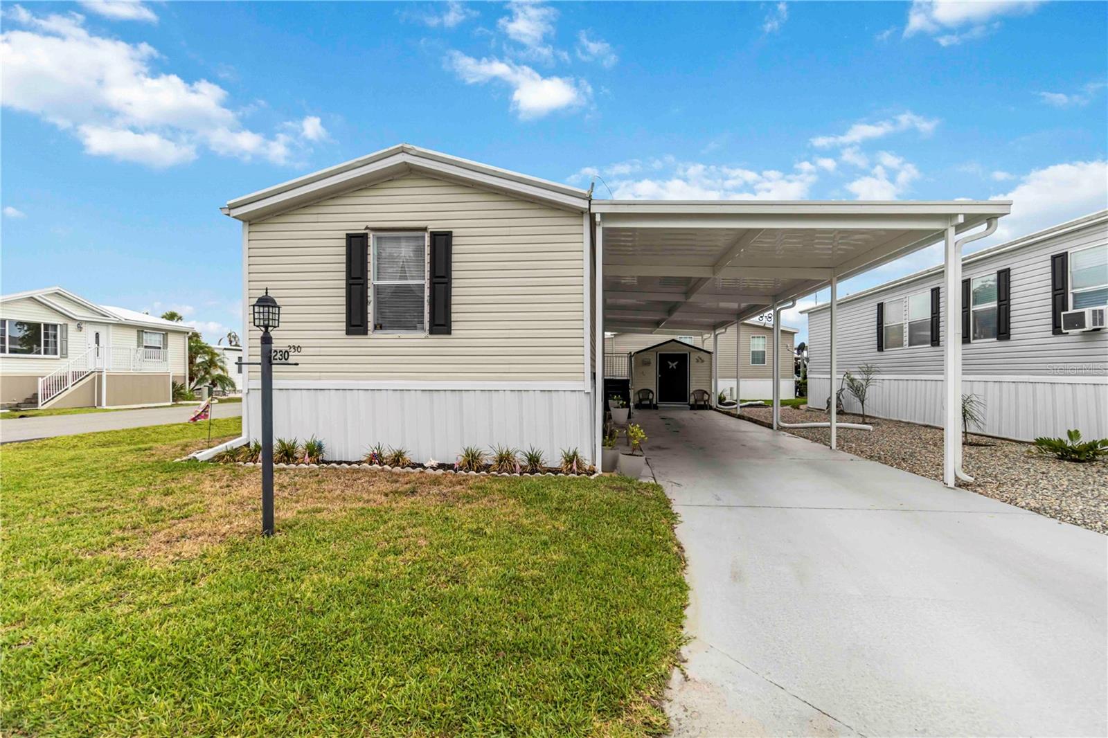 Step into a world of sun-drenched sophistication and carefree coastal living with this beautifully appointed two-bedroom, two-bathroom residence in the prestigious 55+ community of Eagle Point in Punta Gorda. Designed to exceed expectations, this 896-square-foot 2006 home offers an exceptional blend of elegance and practicality in an enchanting waterfront setting where every day feels like a vacation. Inside, rich laminate flooring flows seamlessly throughout the open-concept living space—there is not a stitch of carpet to be found—providing the perfect backdrop for effortless entertaining and relaxed Florida living. An in-home washer and dryer add convenience, while thoughtful upgrades deliver peace of mind. The spacious main bedroom features an oversized closet and a luxurious en suite bathroom complete with a walk-in shower, offering a private sanctuary where you can unwind in style. A second well-appointed bathroom with a tub and shower combo ensures comfort for family and guests alike.
Outdoors, a charming patio beckons you to linger in the glow of breathtaking Florida sunsets, the perfect setting for cocktails or quiet reflection. A dedicated storage shed adds functionality, while a meticulously maintained roof (2018), a brand-new air conditioning system (2023), and eleven new tiedowns provide confidence in every season. The newly redone carport and carport roof (2024) enhance both aesthetics and durability, ensuring this home is as beautiful as it is dependable.
Yet, what truly elevates this offering is its location within Eagle Point, one of Southwest Florida’s most coveted pet-friendly communities. Here, life unfolds against a backdrop of resort-caliber amenities designed to delight. Just steps from your door, you’ll find a sparkling heated pool where sun-dappled afternoons turn into magical evenings. A vibrant Wi-Fi-enabled social hall, well-stocked library, game and card rooms, and dedicated grilling and firepit areas invite connection and celebration. Outdoor spaces are thoughtfully curated for active lifestyles, with bocce ball and shuffleboard courts ready for friendly competition. For those drawn to the water, Eagle Point offers direct access to Alligator Creek and the Gulf of Mexico. Residents can indulge in boating adventures from the private launch, arrange for optional dockage and storage, or simply savor the serene beauty from a scenic fishing pier overlooking a tranquil nature preserve.
As a Park-Share Community, Eagle Point combines the benefits of ownership with a well-managed association. Refundable shares accompany the home purchase, and quarterly association dues—based on the number of shares owned—cover an array of essential services, including lot rent, water, sewer, trash removal, recreational facilities, and private road maintenance, leaving you free to enjoy an unparalleled lifestyle without worry.
Perfectly positioned just moments from the heart of Punta Gorda, this exquisite home places you within easy reach of the city’s vibrant downtown scene, the boutique charm of Fisherman’s Village, the picturesque Harbor Walk, and an array of top-tier golf courses and pristine parks. With the Punta Gorda Airport conveniently nearby, your gateway to adventure is always close at hand.
Don’t miss the rare opportunity to own a slice of paradise in one of Florida’s most charming and affordable waterfront communities. Your dream lifestyle awaits at Eagle Point.