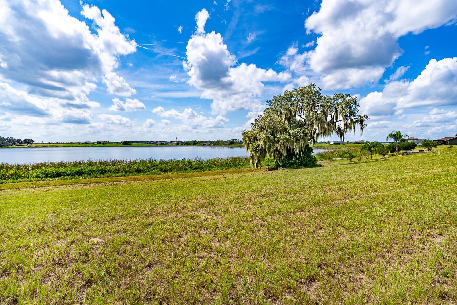Discover a rare opportunity to own this prime lakefront vacant land, perfectly situated in a gated high-end community. With a westerly facing orientation, you can enjoy breathtaking sunsets right from your future home.
This desirable building site is nestled within a mature community, featuring beautifully landscaped surroundings. Residents have access to luxurious amenities, including a sparkling pool, tennis courts, a fully equipped gym, and a welcoming clubhouse.
Create your dream retreat in this idyllic setting where natural beauty meets upscale living. Don’t miss your chance to secure this exceptional property—schedule a visit today!
