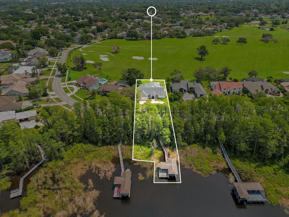 If you can’t decide between the waterfront and golf lifestyle look no further because here is your chance to have both in one property. This extremely rare Bay Hill property is situated on almost a half-acre lot with 100 feet of lake frontage on Tibet and 106 feet of golf frontage overlooking the 4th fairway. Wow your guests with panoramic golf course views overlooking the 4th fairway. Lake is just a stone throw away with your covered dock including a boat lift and jet ski lift that can accommodate two skis. Lake Tibet is over 1,000+ acres of pristine waters with access to the famous Butler Chain of Lakes consisting of 12 interconnected lakes amounting to over 5,000+ acres. Possibilities are endless with great fishing, skiing, tubing, or just cruising around and exploring the different lakes. Additionally, the property is just around the corner from Arnold Palmer’s Bay Hill Club and Lodge, providing lake access to The Butler Chain of Lakes, close proximity to Restaurant Row, area attractions, the airport, and great schools. Imagine all that life has to offer in this amazing Bay Hill golf and waterfront property.