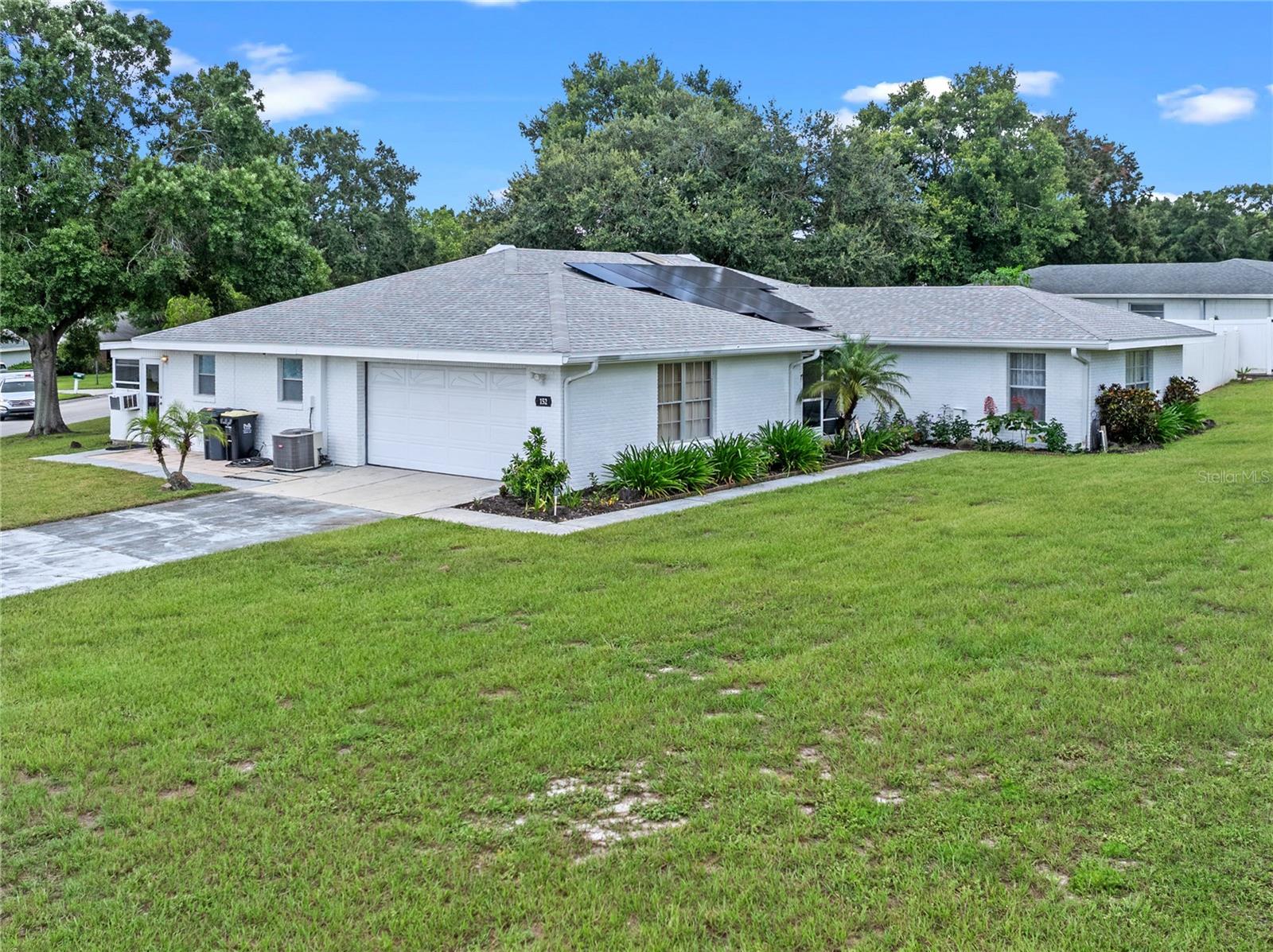 GREAT 3 BEDROOM, 2 BATHROOM HOME ON AN OVERSIZED (.42 AC) CORNER LOT WITH PEACEFUL VIEWS OVER LAKE DAISY! NEWER SOLAR PANELS WILL SAVE YOU HUNDREDS OF DOLLARS MONTHLY ON YOUR UTILITY BILL. THE ROOF, AC AND SKYLIGHT WERE INSTALLED IN 2023. THERE WILL ALSO BE SIGNIFICANT SAVINGS ON YOUR WATER BILL WITH A NEWER IRRIGATION PUMP MOTOR ON YOUR VERY OWN WELL! The side yard is very private with vinyl fencing and a shed for lots of storage. The oversized garage is 25 x 21 and the large driveway is great for visitor parking. You'll love the kitchen that flows into the bonus room that gives you plenty of room for the entire family. The Florida Room has ample space for all your entertaining with beautiful lake views! Garden Grove Elementary is in close proximity to this wonderful home as well as medical, shopping, dining and LEGOLAND. Don't forget about the public boat ramp access to Lake Daisy and all other ramps including those on the famous Chain Of Lakes!!!