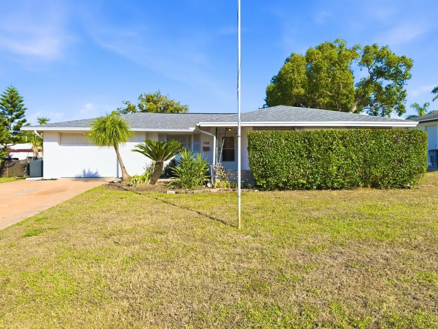 Nestled in Jasmine Lakes, this well-cared-for 2-bed, 2-bath home offers solid value and peace of mind with a newer roof (2020), and a brand-new water heater and A/C system was just installed(2025). While not recently updated, the home is in excellent condition, freshly and professionally cleaned, and full of opportunity for a new owner to add personal touches and build instant sweat equity. The spacious primary bedroom features dual closets and a private ensuite bath with a walk-in shower. At the heart of the home, the kitchen includes a built-in table and flows nicely into the living spaces. Enjoy the fully enclosed lanai with real glass windows—perfect for relaxing year-round that looks out to the spacious back yard. Additional highlights include an oversized one-car garage with built-in storage, an exterior shed equipped with electricity, and a working irrigation well with a full sprinkler system. Don’t miss the chance to make this charming home your own—schedule your showing today!