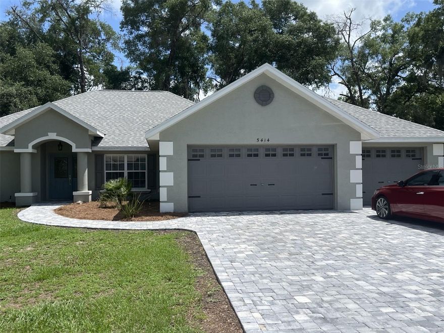 Welcome to this beautifully updated 4-bedroom, 2-bath home situated on a quarter-acre lot at the end of a quiet street in Belleview. Backing to a dry retention area, this property offers added privacy and a spacious feel that is hard to find.

Designed with both comfort and functionality in mind, this home features 1,874 square feet of living space and an impressive 3-car garage, providing plenty of room for vehicles, storage, hobbies, or a workshop. Recent upgrades throughout the home include a new roof and HVAC system installed in 2025, giving buyers added peace of mind for years to come.

Inside, you'll find a fresh, modern interior with quartz countertops, updated sinks, contemporary lighting fixtures, and stylish finishes throughout. The open living areas flow seamlessly, making the home ideal for both everyday living and entertaining. Gas service is available, offering flexibility for future appliance upgrades.

Outside, enjoy the curb appeal of the new paver driveway and sidewalk, along with a partially fenced backyard that provides privacy and space for pets, play, gardening, or outdoor gatherings.

Conveniently located near shopping, dining, schools, and major commuting routes, this move-in-ready home combines modern updates, a desirable layout, and a private setting. Schedule your showing today and see everything this exceptional Belleview property has to offer! The low $50 HOA makes this gated community a fantastic choice. Call for an appointment.