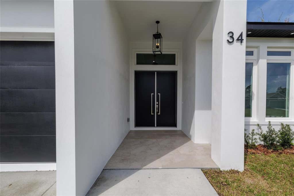 Photo of 34 Fallen Oak Lane, Palm Coast, FL 32137 (MLS # FC320738)