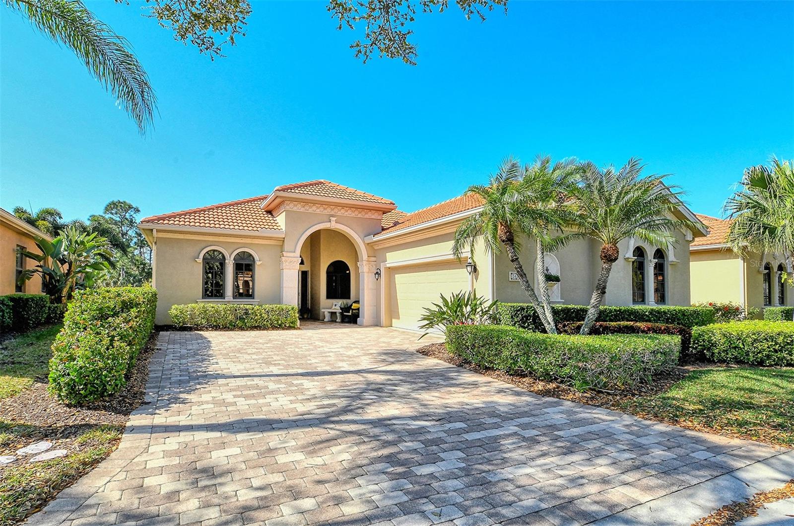 Move in ready Tuscan style maintenance free pool home on a very private lake lot with preserve beyond (no road noise)* This exquisite home located in the boutique community of The Vineyards in Silver Oak* Just 74 custom homes by Gibraltar Builders with private amenity center which includes a pool, fitness & clubhouse* Featuring 3 bedrooms (one is currently used as an office), separate living room, family room, dining room with spacious eat in kitchen* Living room has disappearing wall sliders leading to the recently refinished heated pool & an outdoor kitchen* The generous lanai overlooks total privacy with lake & preserve views* Beautiful real hardwood floors throughout the living area* Custom millwork & numerous architectural features including tray ceilings* The private owners suite features a large soaking tub & generous closet space* Natural gas features* Courtyard 2 car garage* Architectural stone trim on the front of the home gives it a true Mediterranean feel* Owners have added approx. $ 8,000 in fans & $15,000 in refinishing the pool* Located very near Legacy Trail, shopping & minutes to world famous Siesta Key Beach*