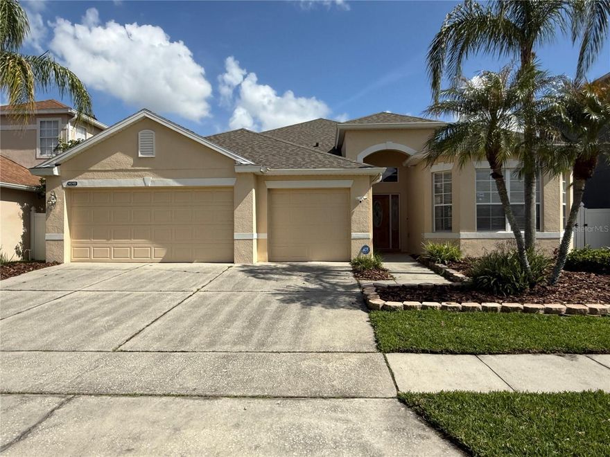 Beautiful Home in Wyndham Lakes Estates only five minutes from Lake Nona Boxi Park, Medical City.  Well-manicured community landscape with lovely ponds throughout. This single-story 4-bedroom, 2-bath home with a 3-car garage offers the perfect blend of style, comfort, and functionality in one of the most desired areas of Orlando, just minutes from the airport, 417, 528 and the turnpike.  The split floor plan provides privacy. On one side of the house the Primary Suite features a spacious walk-in closet, walk-in shower, or soak-in jacuzzi tub. On the opposite side are 3 bedrooms and guest baths perfect for guests or in-laws. Love your space? You’ll appreciate the oversized 3-car garage. Step out to the private screened patio and relax.  Have pets or little ones? The fully fenced yard keeps everyone secure on-site. Recent updates include: New Roof (approximate 4 years). Enjoy a low HOA that includes cable and internet, plus resort-style amenities—clubhouse, pool, gym, basketball and tennis courts. This is the perfect place to call home—beautiful, move-in ready, and part of a wonderful community. Welcome home to Wyndham Lakes Estates!