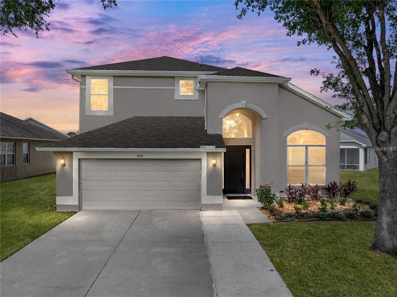 This stunning 4BD/2.5BA home is located in the established community of Hamilton Park in Wesley Chapel. Upon entering, you will be greeted by new luxury vinyl plank flooring as well a stunning foyer chandelier. The formal Living and Dining room make the perfect area for entertaining and feature a high ceiling. The dining room has a stunning upgraded chandelier. Moving further into the home you will find Kitchen and Great room. The Kitchen boasts stainless appliances, stone counters, a breakfast bar, and an eating space with upgraded lighting. The Great room is bright and open with another gorgeous chandelier and sliders to the back patio. Off the Great room is the Primary bedroom featuring an En Suite and two walk-in closets, a dual sink vanity, jacuzzi tub, and glass shower. Progressing up the stairs, you will find beautiful dark wood-look laminate on the stairs and throughout the entire second floor. At the top of the stairs is a loft that would make a nice seating or media area. Three bedrooms and one full bathroom align throughout the second level. Upgrades: Roof 2025, Luxury Vinyl Plank flooring downstairs 2024, Refrigerator, Dishwasher, Washer and Dryer 2024. This home is move in ready and close to entertainment, transportation, parks, shopping, and dining. Schedule your showing today! One or more photo(s) has been virtually staged.