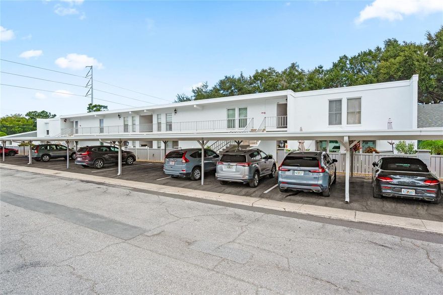 WOW! What a beautiful 2 bed 2 bath unit in a quiet 55+ community! Move right in, because the unit is offered all furnished! Beautiful engineered hardwood floor! The bathrooms are tastefully updated. Primary bedroom has a large walk-in closet. Enjoy the spacious bright sunroom (8x21), which can be used as an office, or just to relax looking out beautiful greenery! The community amenities include: pool, clubhouse, shuffleboard and private courtyard area where residents can meet new neighbors and friends. Just minutes to the beautiful gulf beaches, restaurants and shopping centers. Not in the flood zone. HURRY!!! THIS ONE WON'T LAST!