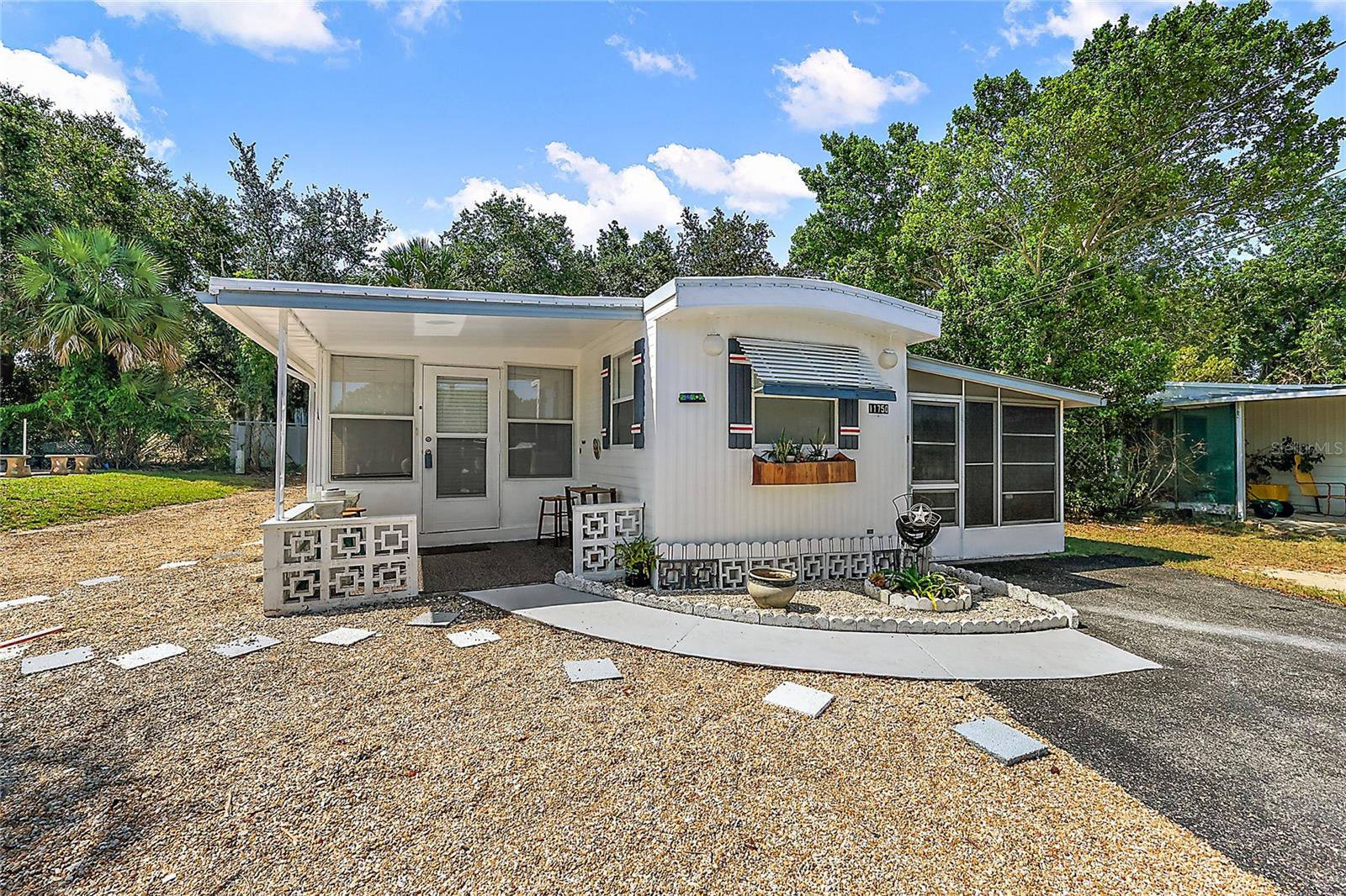 This 2-bedroom, 2-bath furnished mobile home located in the charming 55+ adult golf cart community of Imperial Terrace West in Tavares offers a cozy and affordable living option. The home has been painted within the last year, includes vinyl wood flooring, ceramic tile flooring in the fully screened in Florida Room, new refrigerator, chest freezer, laundry room with storage, tie-downs, outside storage room, AND YOU OWN THE LAND!! The community has a clubhouse with pool table, indoor pool and jacuzzi. There are covered boat slips available for a fee. Many community fun events are planned throughout the year. It is a great balance of comfort and convenience with nearby access to the Harris Chain of Lakes, shopping and restaurants. Come check it out today!