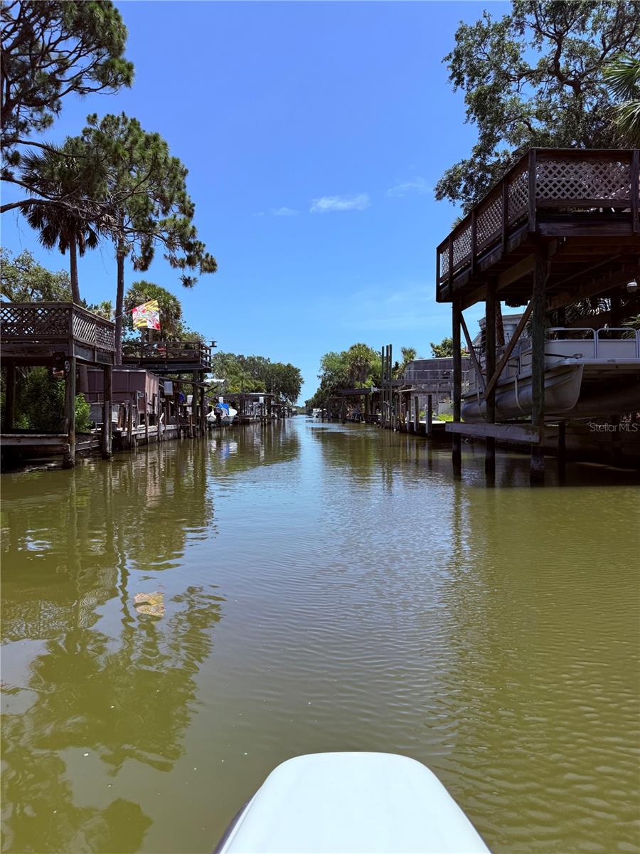 PRICE IMPROVEMENT- SELLER MOTIVATED! Keep your boat in your backyard on this deep waterfront canal! This is your chance to build your dream home on a canal lot with direct access to Indian River Lagoon! Located in the highly sought-after South Waterfront Park neighborhood of Edgewater, Florida. This property offers a solid, 50 foot concrete seawall and paid impact fees. You can start building immediately with public water, sewer, and electricity connections already in place. Enjoy the benefits of waterfront living with exclusive canal access. High-end homes are already being built within the community. Just a short boat cruise to world class fishing at Mosquito Lagoon or a sunny ride to Ponce Inlet and Disappearing Island, JBs fish camp and more. Catch tarpon, snook, trout and redfish from your backyard! Edgewater is growing quickly and this is a highly desirable canal front community. Conveniently located near New Smyrna Beach and Cape Canaveral. This lot offers the best of Florida living – a peaceful retreat, easy access to the beautiful beaches and a vibrant pulse of the community. Surrounded by newly built homes, you don’t want to miss this opportunity to create your very own paradise.
