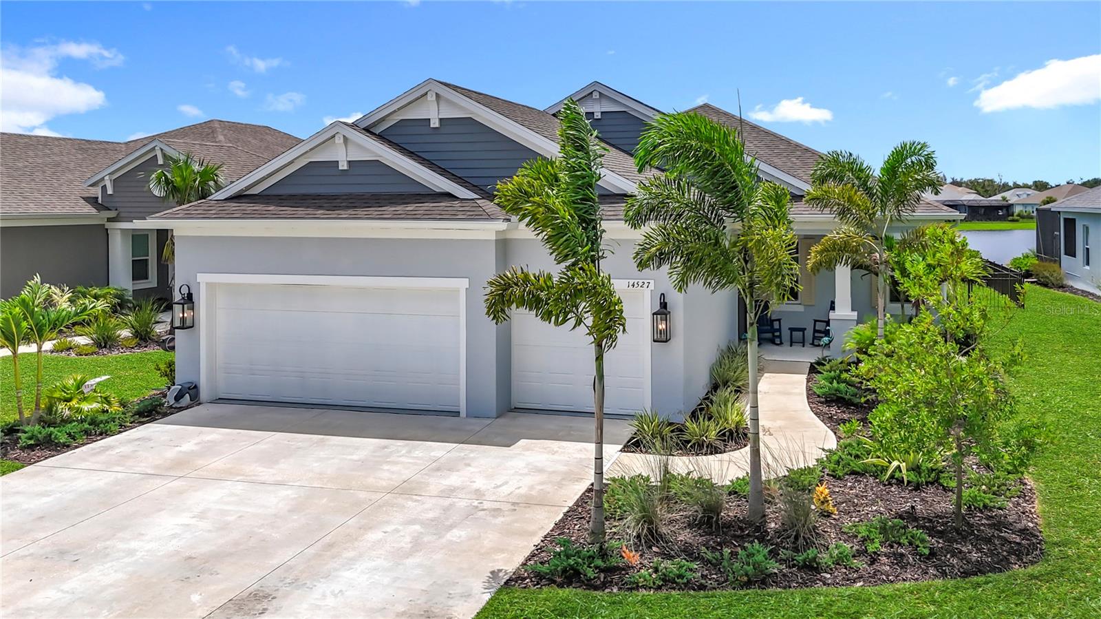 Built in 2024, this stunning 4BR/2.5BA home in gated Canoe Creek blends modern design, luxury upgrades, and resort-style amenities—all with low HOA fees and no CDDs. The flexible 4th bedroom with wine wall and glass doors doubles as a den, office, or guest suite. The 3-car garage is currently a gameroom with epoxy floors, bar with lighting, mini-split AC, and overhead storage—yet still allows vehicle parking if desired. Inside you’ll find wood-look tile throughout, premium accent walls, smart Govee lighting, a built-in fireplace, and a gourmet kitchen with gas cooktop, wall oven, quartz counters, and walk-in pantry. The primary suite features a modern bath with dual sinks and two walk-in closets. Outdoor living shines with an oversized lanai, outdoor kitchen with gas griddle, fridge, speakers, oversized fan, a permanent firepit, paver patios, fenced yard, and panoramic screened lake views—perfect for enjoying sunsets.