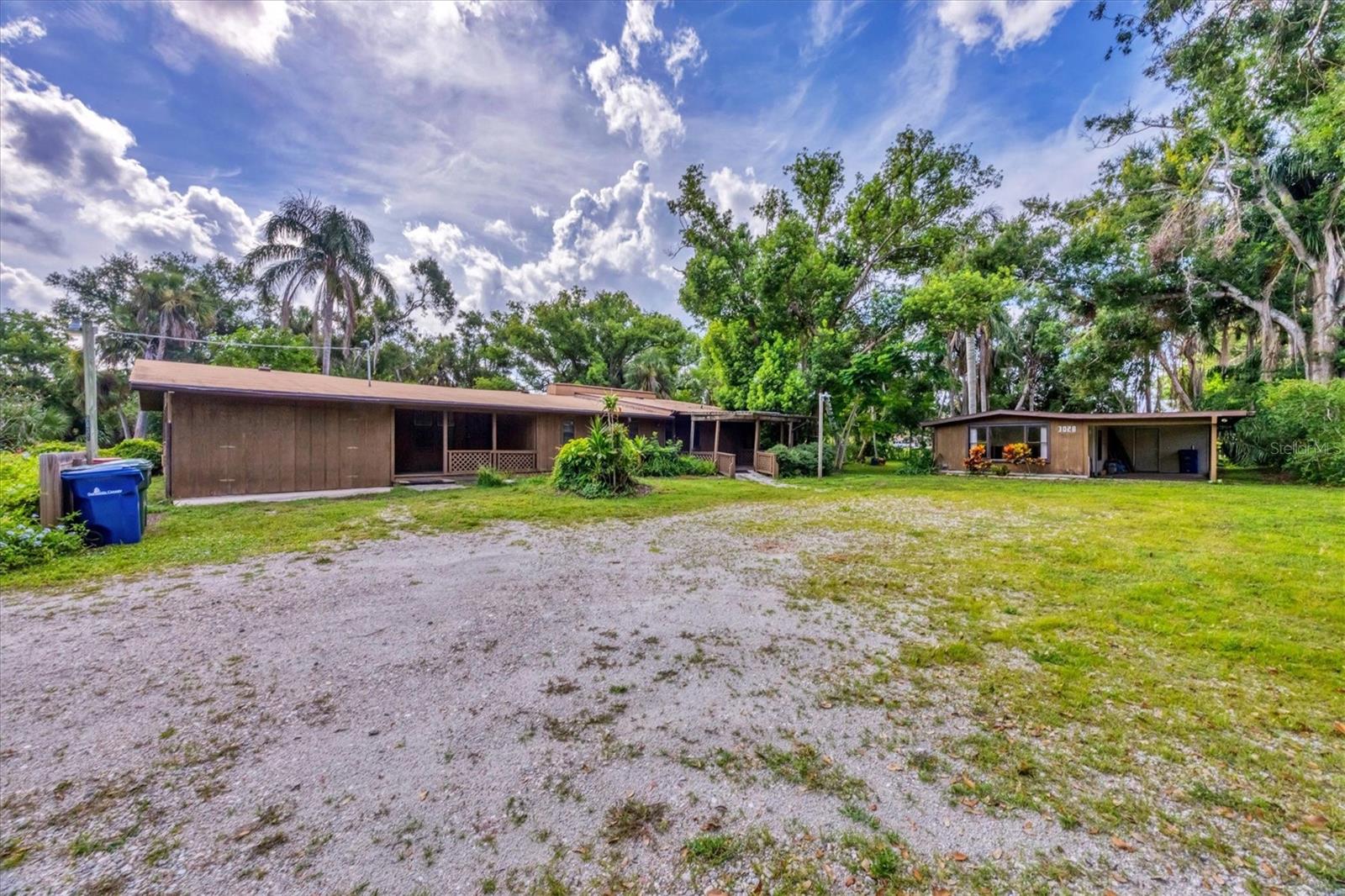 Rare opportunity for multiple family living! Several lots combined to make one, options are endless here. Priced to sell, and opportunities are endless. Conveniently located in the heart of Sarasota, with mature landscaping, walking trail to the park nearby, this is the perfect opportunity to have the space you desire, without the hassle of living on the outskirts of town. The three quarter acre site is comprised of lush vegetation for plenty of shade from the Florida heat. No HOA means complete freedom to park your boat, trailer or RV in the abundant drive space, or build your brand new dream home. Unique and serene are words that only start to describe this one-of-a-kind opportunity. Don’t wait- schedule your private showing today! Sold AS IS.