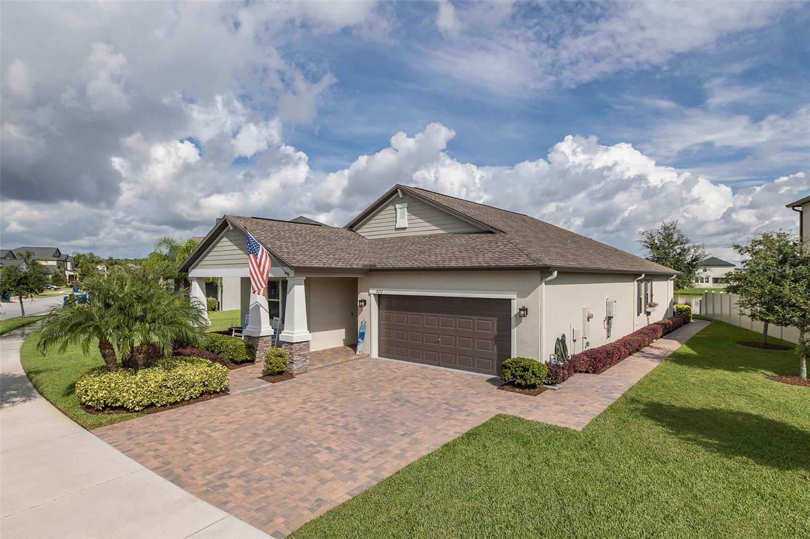 MODEL PERFECT Bryant Square NEWER home features 4 bedrooms, 3 bathrooms + 2 car garage & spans over 2,061 sqare feet. This home is perfectly situated on the LARGEST PREMIUM HOMESITE with SERENE POND VIEWS! The pavered driveway & UPGRADED LANDSCAPING greets you and custom glass front door welcomes you. This OPEN FLOOR PLAN lives large and designer tile flooring flows throughout the living areas. The kitchen is a chef's delight and boasts rich expresso cabinetry, gleaming granite counters, NEW stainless steel appliances & custom designer backsplash. The dining room & family room are spacious & offer rich crown molding, neutral tile flooring & views of gorgeous pond views. The owner's suite is pampering and features custom tray ceiling, pond views & en suite bath is luxurious offering walk-in closet with NEW CUSTOM BUILT-INS, his/her granite vanities, relaxing garden tub and large custom walk-in shower. The laundry room is roomy & adjacent to owners suite. The secondary bedrooms are all generously sized and feature newer hybrid wood flooring. There are 2 guest bathrooms & a drop zone that completes this amazing floor plan. Enjoy the Florida sun in your tropical back yard which is enhanced with new lush landscaping, oversized brick pavered area & enjoy serene pond views or grab some shade in the private screened lanai. This 2020 built home has much to offer its new owner: crown molding throughout, new custom lights & fans, new kitchen appliances, elegant window treatments, rich wood trim around doors & windows, custom closets and so much more! This is one of the largest lots in Bryant Square 1/4 acre. m.o.l. & offers GORGEOUS VIEWS OF THE POND! Conveniently located in TRINITY close to everything; many shops, restaurants, medical facilities, Trinity Hospital, short drive to beautiful local beaches, Tampa International Airport & St. Pete/Clearwater Airport. Zoned for EXCELLENT TRINITY SCHOOLS - walk to Seven Springs Middle or J.W. Mitchell High! Walkable distance to the YMCA of Trinity. Bryant Square community is a community enriched neighborhood offering its residents community pool, clubhouse, dog park, playgrounds & more. Start living the Florida Dream today!