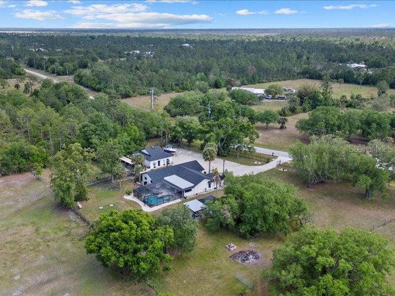 This place just keeps getting better! A gorgeous, renovated 3-bed, 2-bath home on 4.1 acres in the Prairie Creek Park community sounds like the perfect blend of comfort and space. Plus, the ability to have horses, a chicken coop, and store all your toys? It’s like an outdoor enthusiast’s dream come true. The 6-car garage is a huge perk, especially with the option to fit jet-skis, boats, and motorcycles, or even convert part of it into an in-law suite for added flexibility. The RV parking in front is another bonus for anyone with larger vehicles.
The wood-burning fireplace is perfect for cozy nights, and that retreat area by the pool sounds like the ultimate spot to unwind and take in the outdoors. Stables, a carport, chicken coop— there's endless potential here for hobbies, pets, enjoyment and much more.