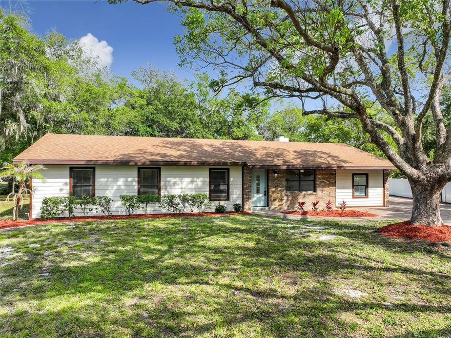 Beautifully renovated home in Oviedo! This stunning 4-bedroom, 2-bathroom residence sits on an expansive 0.4-acre CUL-DE-SAC lot, offering both privacy and space with an extended long PAVER driveway.  Completely updated: ALL NEW FLOORING – wide plank waterproof laminate flooring in the main area, soft new carpet in the bedrooms, and new large tile in the bathrooms, ALL NEW LIGHTING, including additional recessed lights, NEW HARDWARE and FRESH PAINT INSIDE AND OUT.  Peace of mind with the NEW A/C, NEW HOT WATER HEATER, NEW WATER FILTRATION SYSTEM and NEWER ROOF (2021). The open-concept floor plan includes a cozy decorative fireplace and new mantle. The fully remodeled kitchen is a true centerpiece, boasting NEW SOLID WOOD cabinetry, QUARTZ countertops, an oversized island with counter height seating for at least 6, and BRAND-NEW STAINLESS-STEEL appliances. Both updated bathrooms feature plenty of storage and all new everything! The primary bath boasts DOUBLE VANITIES for added comfort.  This home offers multiple access points, including a front door, side door, and French doors that open onto the cover porch, complete with a swing and ceiling fan. Enjoy relaxing on the porch and taking in the tranquil backyard, which provides peaceful views of a FRESHWATER CANAL.  Located in a highly desirable area with A-rated schools, shopping, and dining. This home is just 8 minutes from State Road 417, 9 minutes from the University of Central Florida, and less than 20 minutes from Orlando, making commuting and entertainment incredibly convenient.  This move-in-ready home combines modern upgrades, thoughtful design, and an unbeatable location—don’t miss the opportunity to make it yours! **COMPLETELY REMODELED ** MOVE-IN READY ** GREAT LOCATION ** NO HOA **