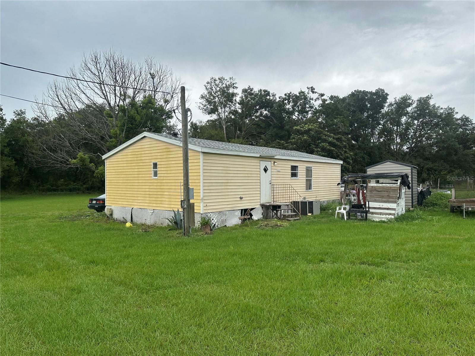 1.15 Acres of beautiful land!! The manufactured home on the land has a NEW ROOF installed November of 2024.
Income producing property! The property is currently being rented for $1400 monthly. The lease just expired and is on a month to month basis now. This property is perfect for homesteaders looking to have chickens, etc. There is NO HOA.
Beautiful property.
Special financing available with large down payment.