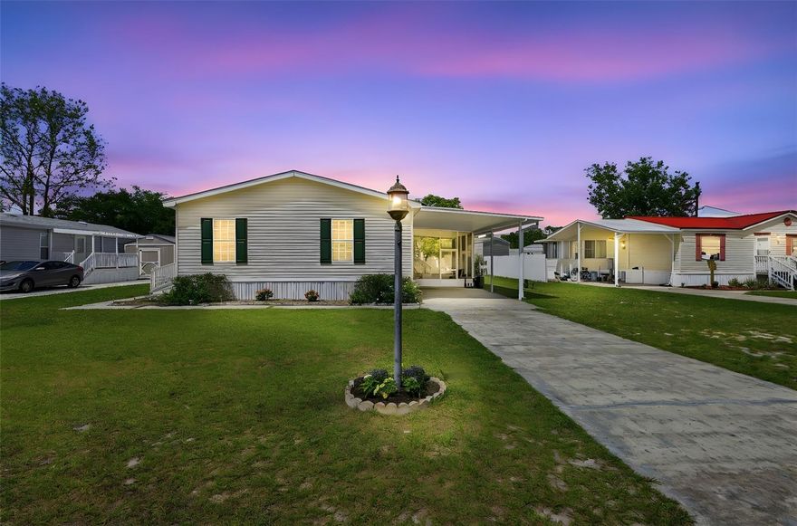 Amazing Snowbird Retreat! Pride of ownership shines in this well-maintained, like-new manufactured home—gently lived in only six months out of the year. Major update includes a roof replaced in 11/2019.
Step inside to a light and bright interior featuring upgraded luxury vinyl plank flooring in the main living areas and primary bedroom. All rooms are equipped with ceiling fans and upgraded blinds for added comfort and style.
The spacious primary suite offers a walk-in closet and a large ensuite bathroom complete with double sinks, a stand-up shower, featuring an upgraded commode, and an oversized linen closet with ample storage. The desirable split floor plan provides privacy, with the secondary bedrooms and guest bath located on the opposite side of the home.
The open-concept kitchen overlooks the dining and living areas and includes white cabinetry with crown molding, a breakfast bar, and an upgraded Bosch dishwasher. All appliances convey, including the washer and dryer.
Exterior features include a front ramp for easy accessibility, a covered carport, and a large screened porch—perfect for relaxing. The backyard offers additional space to enjoy, complete with a large shed and partial fencing.
Bonus: This home can be sold fully furnished—just bring your clothes and start enjoying your Florida retreat right away!
Energy Efficiency: Home is equipped with leased solar panels, helping to offset utility costs. Buyer to assume lease (details available).
Move-in ready and ideal for seasonal or year-round living!