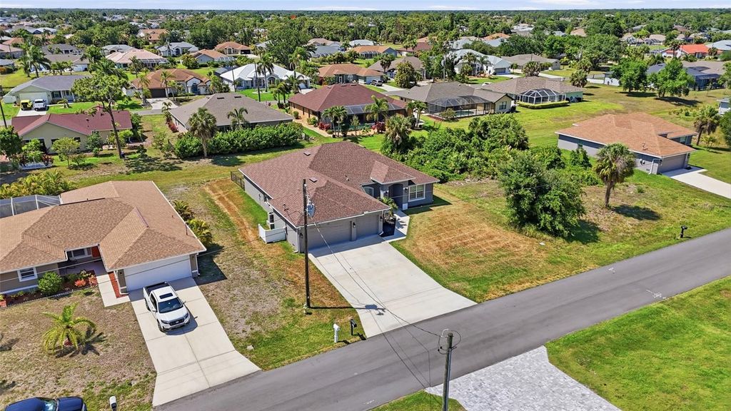 Photo of 119 Long Meadow Lane, Rotonda West, FL 33947 (MLS # O6400126)