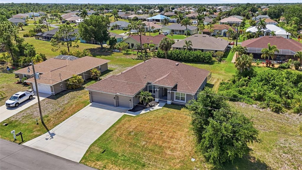 Photo of 119 Long Meadow Lane, Rotonda West, FL 33947 (MLS # O6400126)