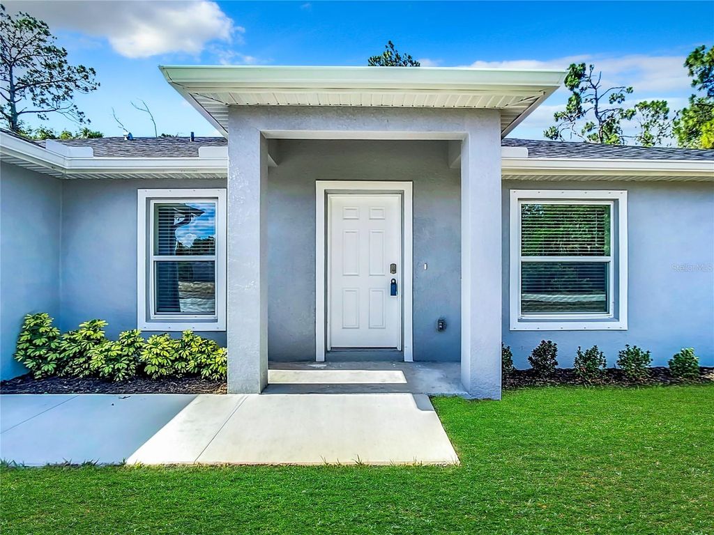 Photo of 14409 Chamberlain Boulevard, Port Charlotte, FL 33953 (MLS # OM709066)