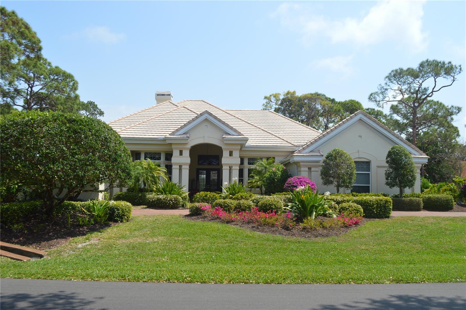 Big views across the lake to 12th fairway of the Heron golf course adorn this Rutenberg built home. This home features 4 bedroom plus office with large rooms volume ceilings and crown molding throughout. Executive office is complimented with built-in cabinetry and hardwood flooring. The Master suite boasts a large bath with new glass shower door, 2 walk-in closets and large sitting area overlooking the lanai and pool area. The Oaks, Sarasota's premier golf and country club, features two 18-hole championship golf courses, 12 HAR-TRU tennis courts maintained to tournament standards, 4 of which are lighted, bocce and pickle ball courts, a junior Olympic community pool, and a wide variety of dining, recreational and social offerings. Membership is required with homeownership.
